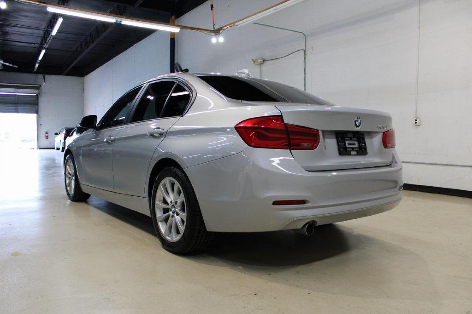 2018 Glacier Silver Metallic /Black BMW 3 Series 320i (WBA8E1G52JN) with an 2.0L 4-Cylinder DOHC 16V TwinPower Turbo engine, Automatic transmission, located at 15300 Midway Rd., Addison, TX, 75001, (972) 702-0011, 32.958321, -96.838074 - HOME OF THE NO HAGGLE PRICE - WHOLESALE PRICES TO THE PUBLIC!! 320i, 4D Sedan, 2.0L 4-Cylinder DOHC 16V TwinPower Turbo, 8-Speed Automatic, RWD, Glacier Silver Metallic, Black Artificial Leather.<br><br>Glacier Silver Metallic 2018 BMW 3 Series 320i<br><br>Recent Arrival! 24/35 City/Highway MPG<br>< - Photo #4