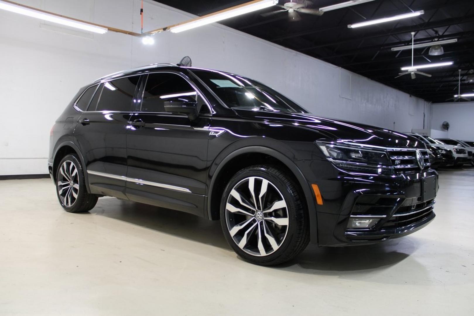 2021 Deep Black Pearl /Saffrano Orange and Black Volkswagen Tiguan 2.0T SEL Premium R-Line (3VV4B7AX4MM) with an 2.0L TSI DOHC engine, Automatic transmission, located at 15300 Midway Rd., Addison, TX, 75001, (972) 702-0011, 32.958321, -96.838074 - Photo#1