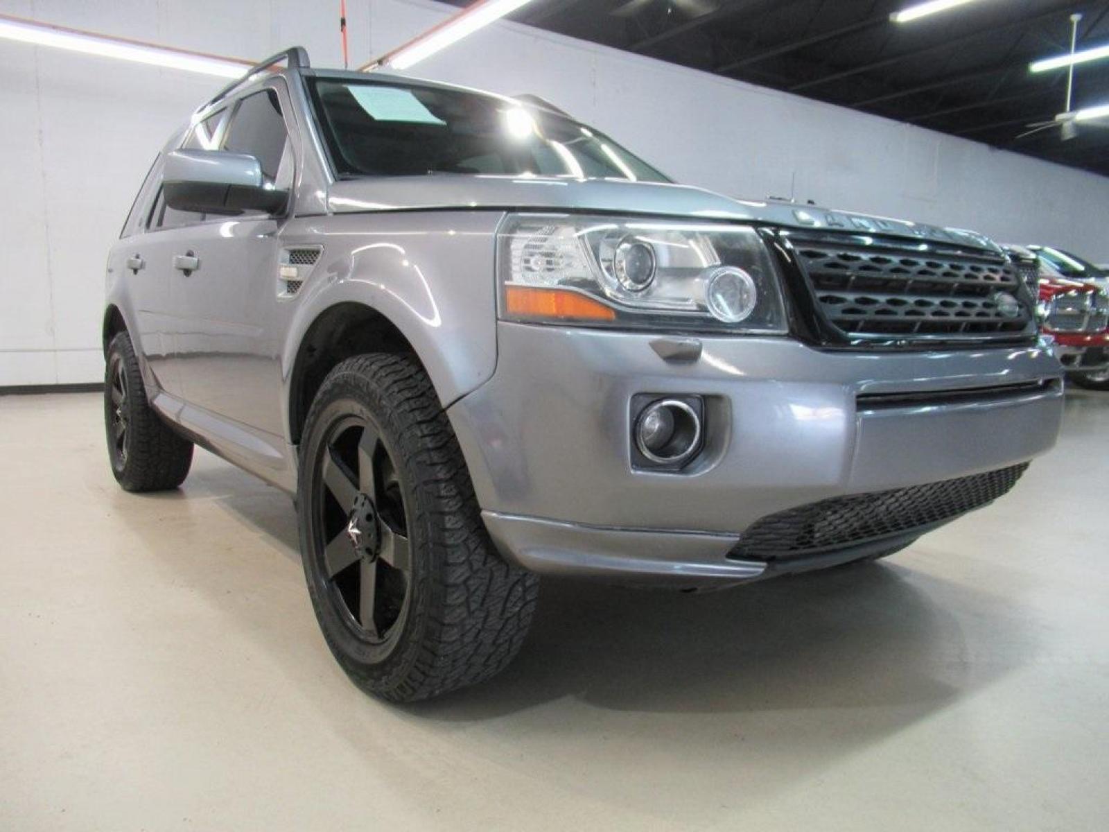 2013 Indus Silver /Ebony Land Rover LR2 Base (SALFR2BG5DH) with an 2.0L 4-Cylinder Turbocharged engine, Automatic transmission, located at 15300 Midway Rd., Addison, 75001, (972) 702-0011, 32.958321, -96.838074 - HOME OF THE NO HAGGLE PRICE - WHOLESALE PRICES TO THE PUBLIC!! 4D Sport Utility, 2.0L 4-Cylinder Turbocharged, 6-Speed Automatic with Command Shift, 4WD, Silver, Ebony Leather.<br><br>Silver 2013 Land Rover LR2<br><br><br>At Midway Auto Group, we strive to provide you with the best quality vehicles - Photo #1