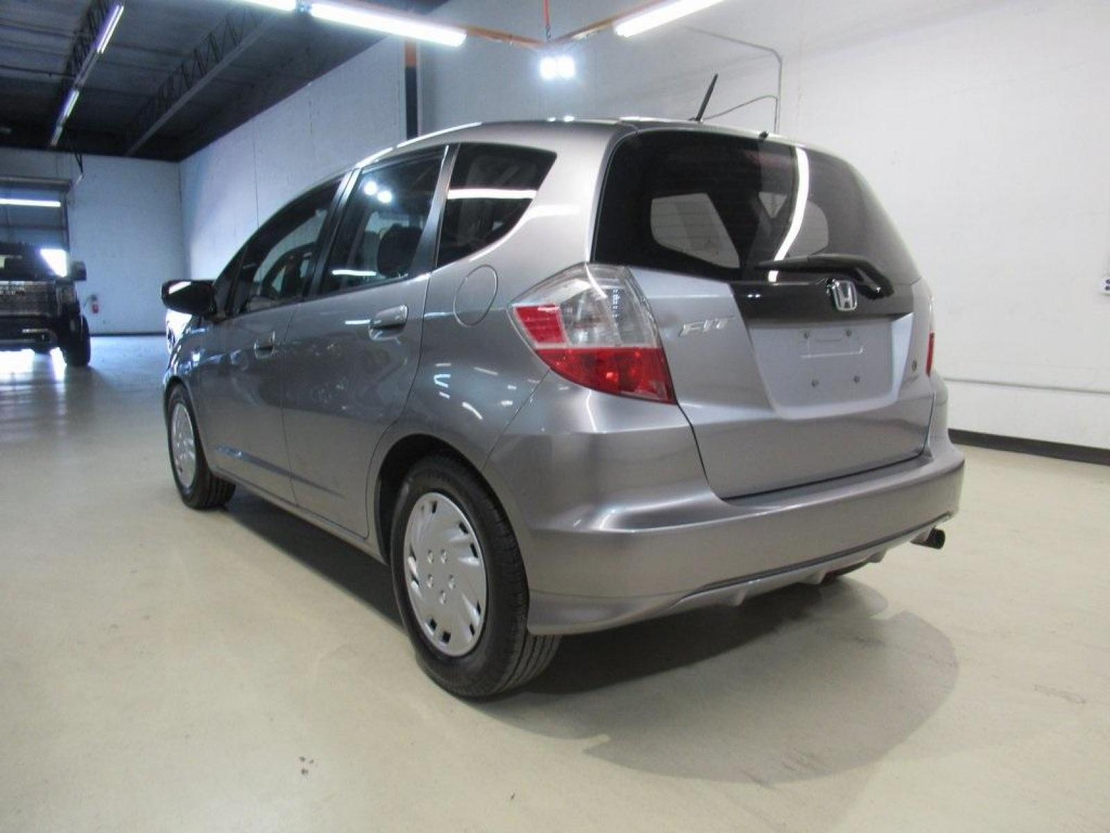 2010 Gray /Gray Honda Fit Base (JHMGE8H20AS) with an 1.5L 16V 4-Cylinder SOHC i-VTEC engine, Automatic transmission, located at 15300 Midway Rd., Addison, 75001, (972) 702-0011, 32.958321, -96.838074 - Photo #3