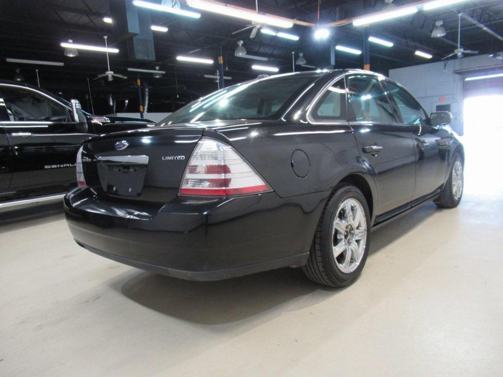 2009 Tuxedo Black Clearcoat Metallic /Medium Light Stone (Gray) Ford Taurus Limited (1FAHP25W29G) with an Duratec 3.5L V6 engine, Automatic transmission, located at 15300 Midway Rd., Addison, 75001, (972) 702-0011, 32.958321, -96.838074 - HOME OF THE NO HAGGLE PRICE - WHOLESALE PRICES TO THE PUBLIC!! Taurus Limited, 4D Sedan, Duratec 3.5L V6, 6-Speed Automatic, FWD, Black, Medium Light Stone (Gray) Leather. Odometer is 61909 miles below market average!<br><br>Black 2009 Ford Taurus Limited<br><br>18/28 City/Highway MPG<br><br>Awards: - Photo #2