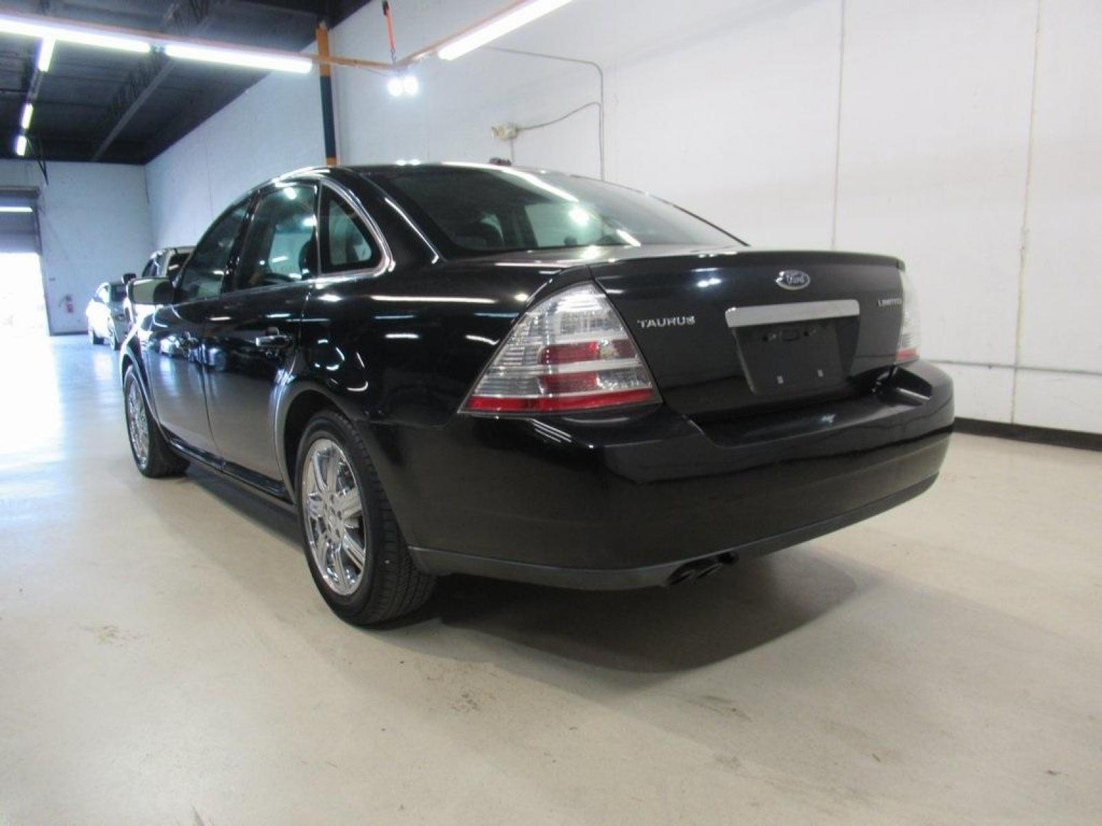 2009 Tuxedo Black Clearcoat Metallic /Medium Light Stone (Gray) Ford Taurus Limited (1FAHP25W29G) with an Duratec 3.5L V6 engine, Automatic transmission, located at 15300 Midway Rd., Addison, 75001, (972) 702-0011, 32.958321, -96.838074 - HOME OF THE NO HAGGLE PRICE - WHOLESALE PRICES TO THE PUBLIC!! Taurus Limited, 4D Sedan, Duratec 3.5L V6, 6-Speed Automatic, FWD, Black, Medium Light Stone (Gray) Leather. Odometer is 61909 miles below market average!<br><br>Black 2009 Ford Taurus Limited<br><br>18/28 City/Highway MPG<br><br>Awards: - Photo #3