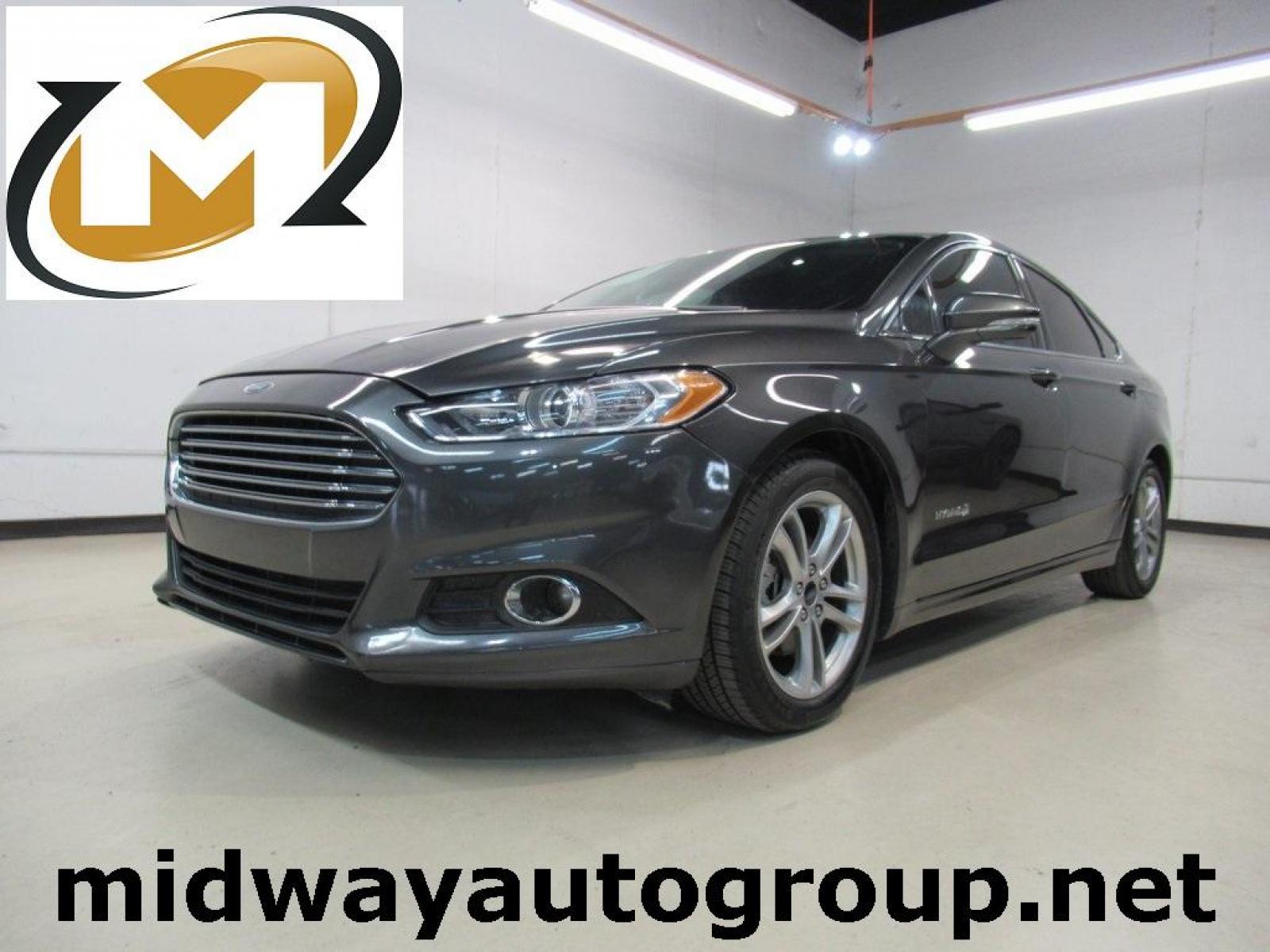 2016 Gray /Earth Gray Ford Fusion Hybrid SE (3FA6P0LU9GR) with an I4 Hybrid engine, CVT transmission, located at 15300 Midway Rd., Addison, 75001, (972) 702-0011, 32.958321, -96.838074 - Photo #0