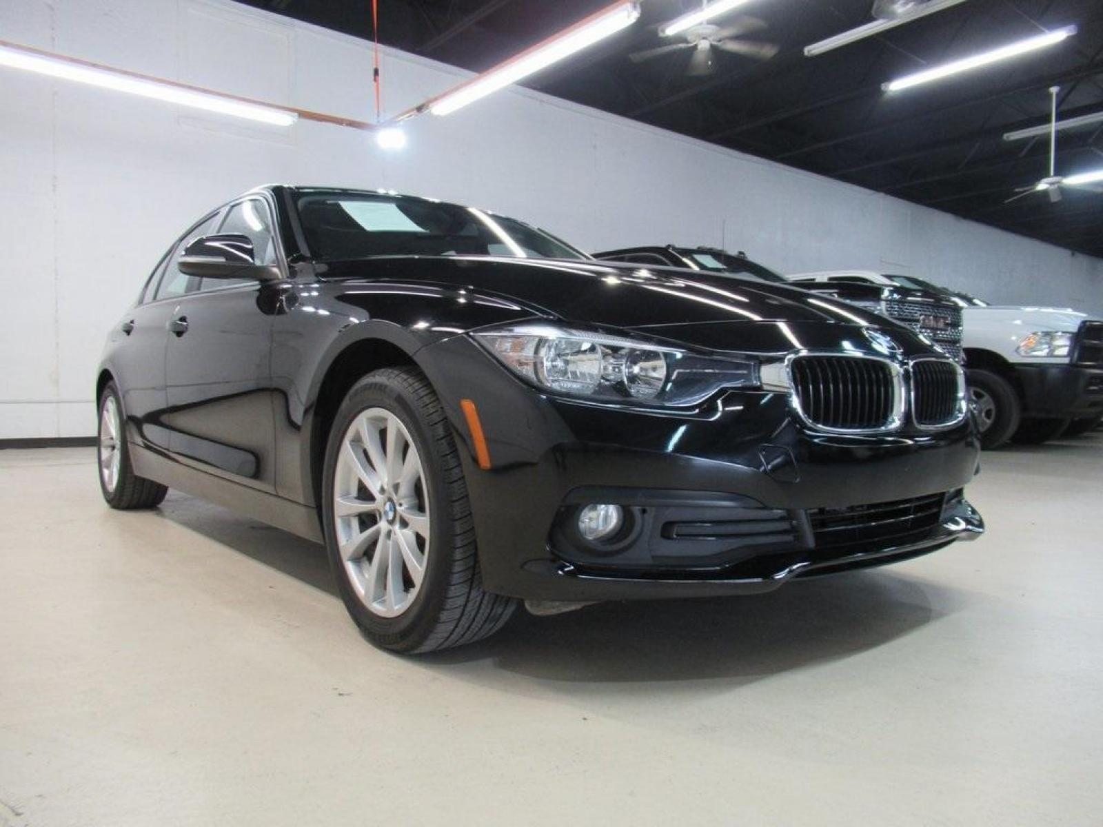 2017 Jet Black /Black BMW 3 Series 320i (WBA8E1G31HN) with an 2.0L 4-Cylinder DOHC 16V TwinPower Turbo engine, Automatic transmission, located at 15300 Midway Rd., Addison, 75001, (972) 702-0011, 32.958321, -96.838074 - HOME OF THE NO HAGGLE PRICE - WHOLESALE PRICES TO THE PUBLIC!! 320i, 4D Sedan, 2.0L 4-Cylinder DOHC 16V TwinPower Turbo, 8-Speed Automatic, RWD, Jet Black, Black Artificial Leather. Odometer is 37381 miles below market average!<br><br>Jet Black 2017 BMW 3 Series 320i<br><br>23/35 City/Highway MPG<br - Photo #1