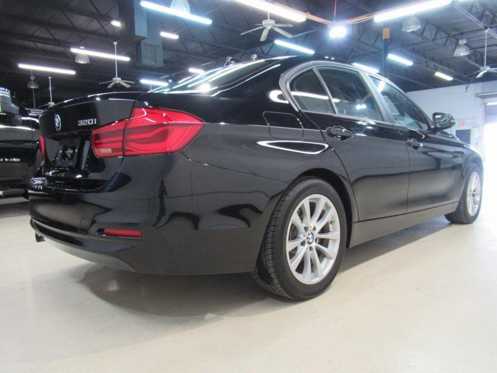 2017 Jet Black /Black BMW 3 Series 320i (WBA8E1G31HN) with an 2.0L 4-Cylinder DOHC 16V TwinPower Turbo engine, Automatic transmission, located at 15300 Midway Rd., Addison, 75001, (972) 702-0011, 32.958321, -96.838074 - HOME OF THE NO HAGGLE PRICE - WHOLESALE PRICES TO THE PUBLIC!! 320i, 4D Sedan, 2.0L 4-Cylinder DOHC 16V TwinPower Turbo, 8-Speed Automatic, RWD, Jet Black, Black Artificial Leather. Odometer is 37381 miles below market average!<br><br>Jet Black 2017 BMW 3 Series 320i<br><br>23/35 City/Highway MPG<br - Photo #2