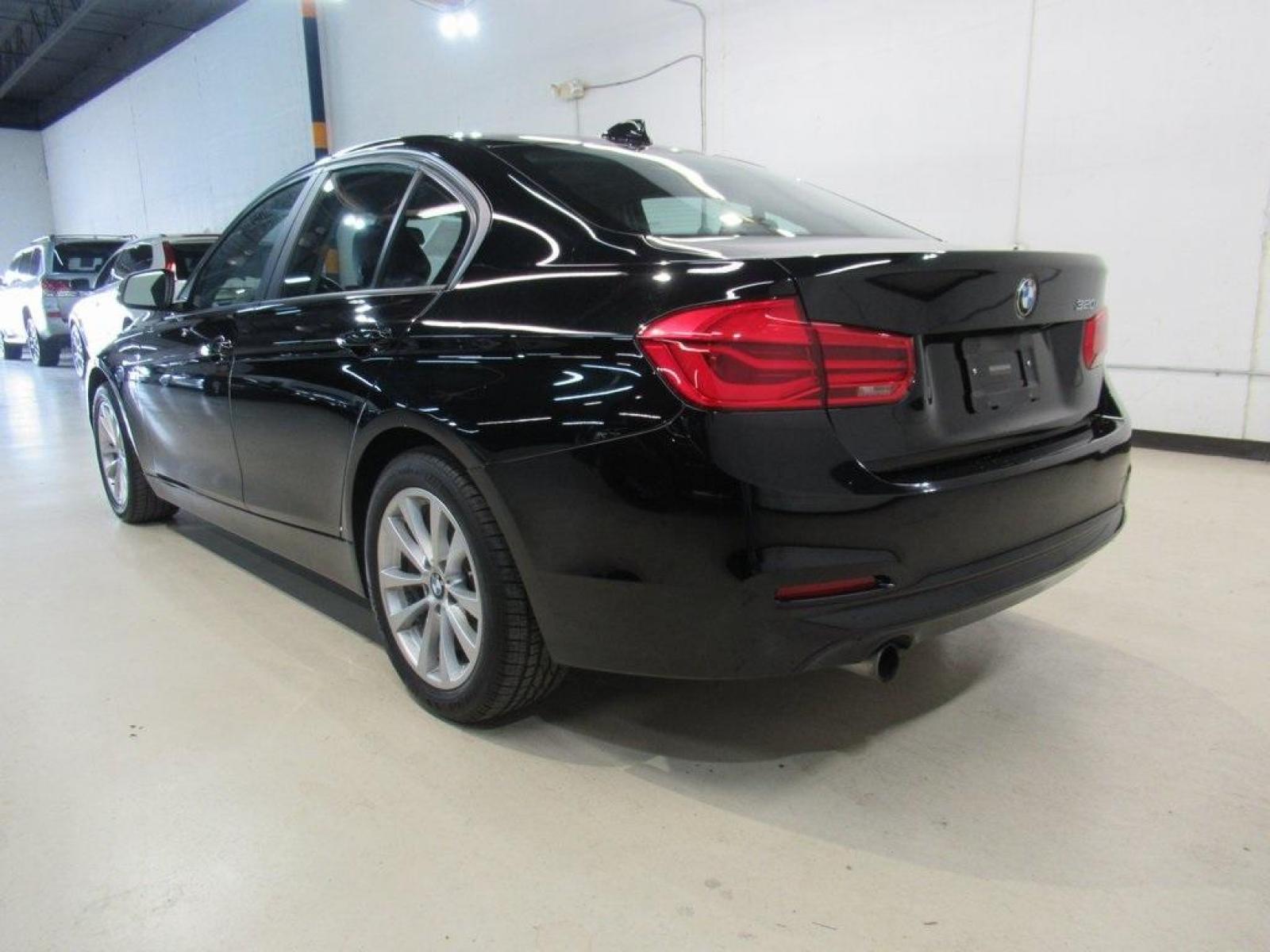 2017 Jet Black /Black BMW 3 Series 320i (WBA8E1G31HN) with an 2.0L 4-Cylinder DOHC 16V TwinPower Turbo engine, Automatic transmission, located at 15300 Midway Rd., Addison, 75001, (972) 702-0011, 32.958321, -96.838074 - HOME OF THE NO HAGGLE PRICE - WHOLESALE PRICES TO THE PUBLIC!! 320i, 4D Sedan, 2.0L 4-Cylinder DOHC 16V TwinPower Turbo, 8-Speed Automatic, RWD, Jet Black, Black Artificial Leather. Odometer is 37381 miles below market average!<br><br>Jet Black 2017 BMW 3 Series 320i<br><br>23/35 City/Highway MPG<br - Photo #3