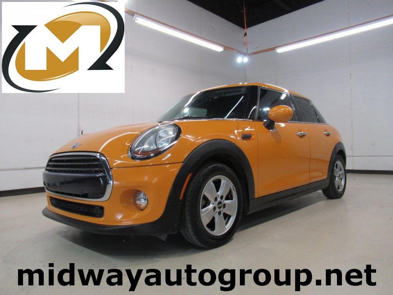 2016 Volcanic Orange /Carbon Black MINI Cooper Base (WMWXU1C51G2) with an 1.5L 12V TwinPower Turbo engine, Automatic transmission, located at 15300 Midway Rd., Addison, 75001, (972) 702-0011, 32.958321, -96.838074 - HOME OF THE NO HAGGLE PRICE - WHOLESALE PRICES TO THE PUBLIC!! 4D Hatchback, 1.5L 12V TwinPower Turbo, 6-Speed Automatic, FWD, Volcanic Orange, Carbon Black Artificial Leather. Odometer is 9768 miles below market average!<br><br>Volcanic Orange 2016 MINI Cooper<br><br>Recent Arrival! 27/37 City/High - Photo #0