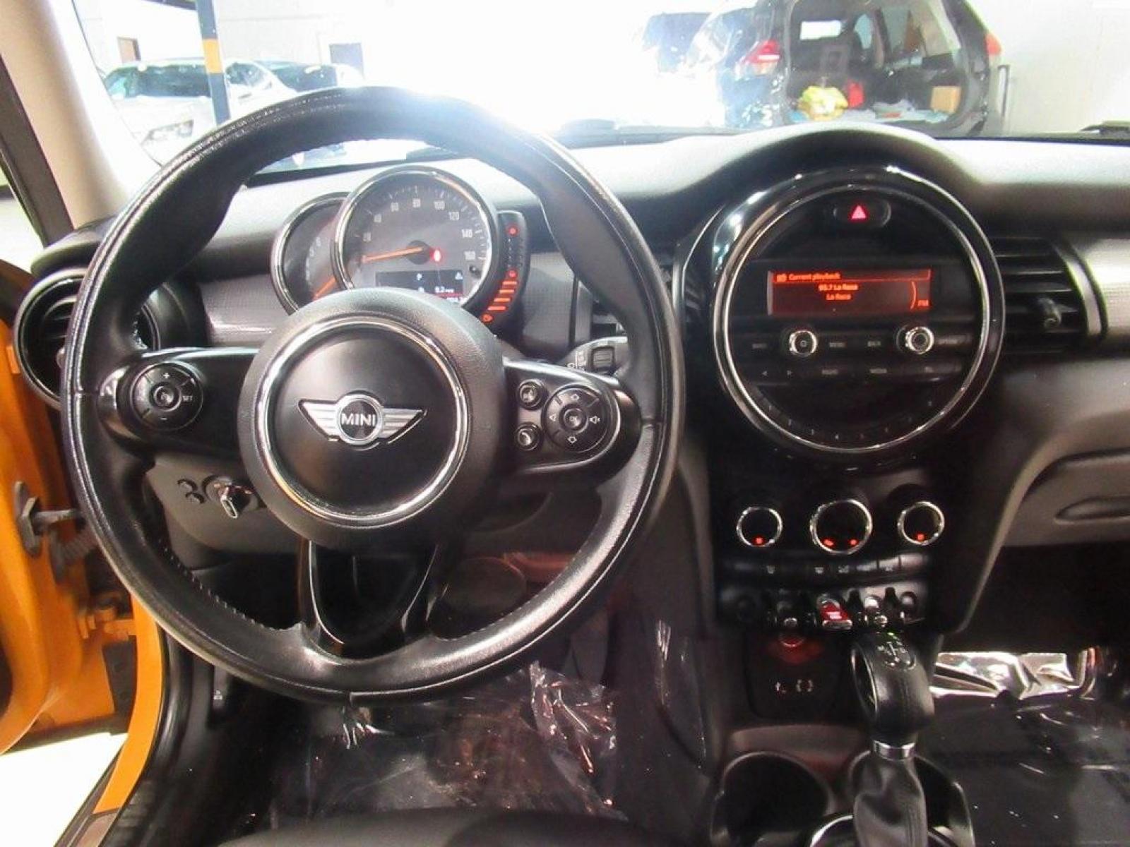 2016 Volcanic Orange /Carbon Black MINI Cooper Base (WMWXU1C51G2) with an 1.5L 12V TwinPower Turbo engine, Automatic transmission, located at 15300 Midway Rd., Addison, 75001, (972) 702-0011, 32.958321, -96.838074 - HOME OF THE NO HAGGLE PRICE - WHOLESALE PRICES TO THE PUBLIC!! 4D Hatchback, 1.5L 12V TwinPower Turbo, 6-Speed Automatic, FWD, Volcanic Orange, Carbon Black Artificial Leather. Odometer is 9768 miles below market average!<br><br>Volcanic Orange 2016 MINI Cooper<br><br>Recent Arrival! 27/37 City/High - Photo #18