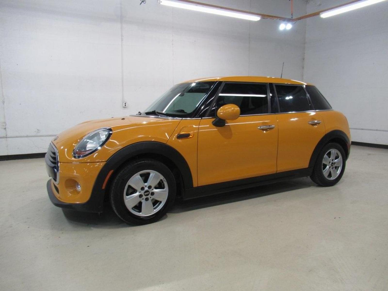 2016 Volcanic Orange /Carbon Black MINI Cooper Base (WMWXU1C51G2) with an 1.5L 12V TwinPower Turbo engine, Automatic transmission, located at 15300 Midway Rd., Addison, 75001, (972) 702-0011, 32.958321, -96.838074 - HOME OF THE NO HAGGLE PRICE - WHOLESALE PRICES TO THE PUBLIC!! 4D Hatchback, 1.5L 12V TwinPower Turbo, 6-Speed Automatic, FWD, Volcanic Orange, Carbon Black Artificial Leather. Odometer is 9768 miles below market average!<br><br>Volcanic Orange 2016 MINI Cooper<br><br>Recent Arrival! 27/37 City/High - Photo #4