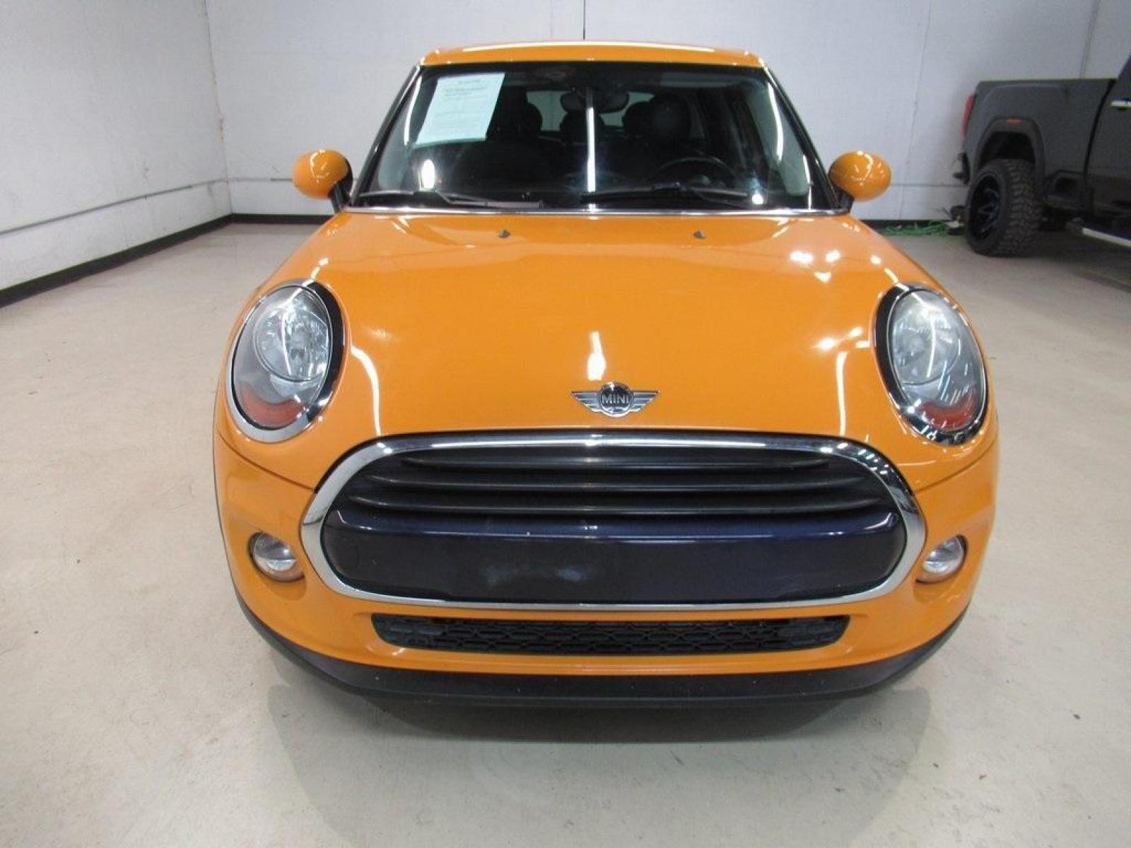 2016 Volcanic Orange /Carbon Black MINI Cooper Base (WMWXU1C51G2) with an 1.5L 12V TwinPower Turbo engine, Automatic transmission, located at 15300 Midway Rd., Addison, 75001, (972) 702-0011, 32.958321, -96.838074 - HOME OF THE NO HAGGLE PRICE - WHOLESALE PRICES TO THE PUBLIC!! 4D Hatchback, 1.5L 12V TwinPower Turbo, 6-Speed Automatic, FWD, Volcanic Orange, Carbon Black Artificial Leather. Odometer is 9768 miles below market average!<br><br>Volcanic Orange 2016 MINI Cooper<br><br>Recent Arrival! 27/37 City/High - Photo #5