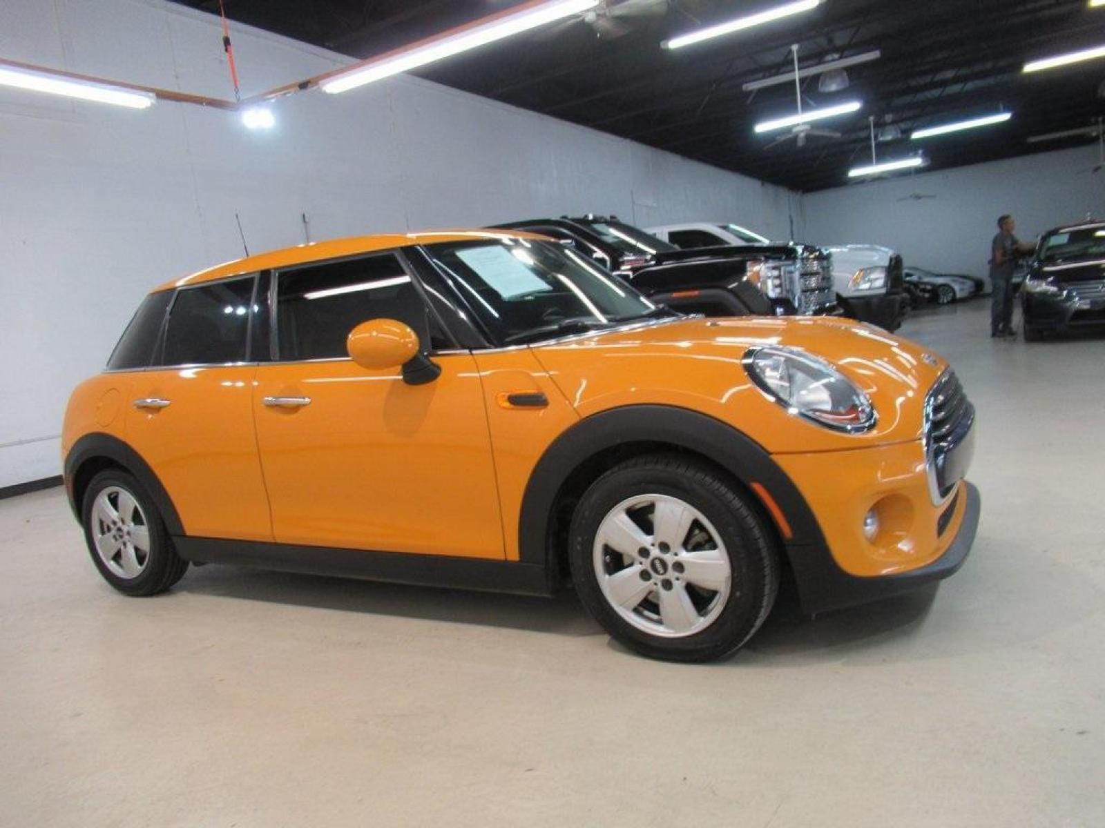 2016 Volcanic Orange /Carbon Black MINI Cooper Base (WMWXU1C51G2) with an 1.5L 12V TwinPower Turbo engine, Automatic transmission, located at 15300 Midway Rd., Addison, 75001, (972) 702-0011, 32.958321, -96.838074 - HOME OF THE NO HAGGLE PRICE - WHOLESALE PRICES TO THE PUBLIC!! 4D Hatchback, 1.5L 12V TwinPower Turbo, 6-Speed Automatic, FWD, Volcanic Orange, Carbon Black Artificial Leather. Odometer is 9768 miles below market average!<br><br>Volcanic Orange 2016 MINI Cooper<br><br>Recent Arrival! 27/37 City/High - Photo #6
