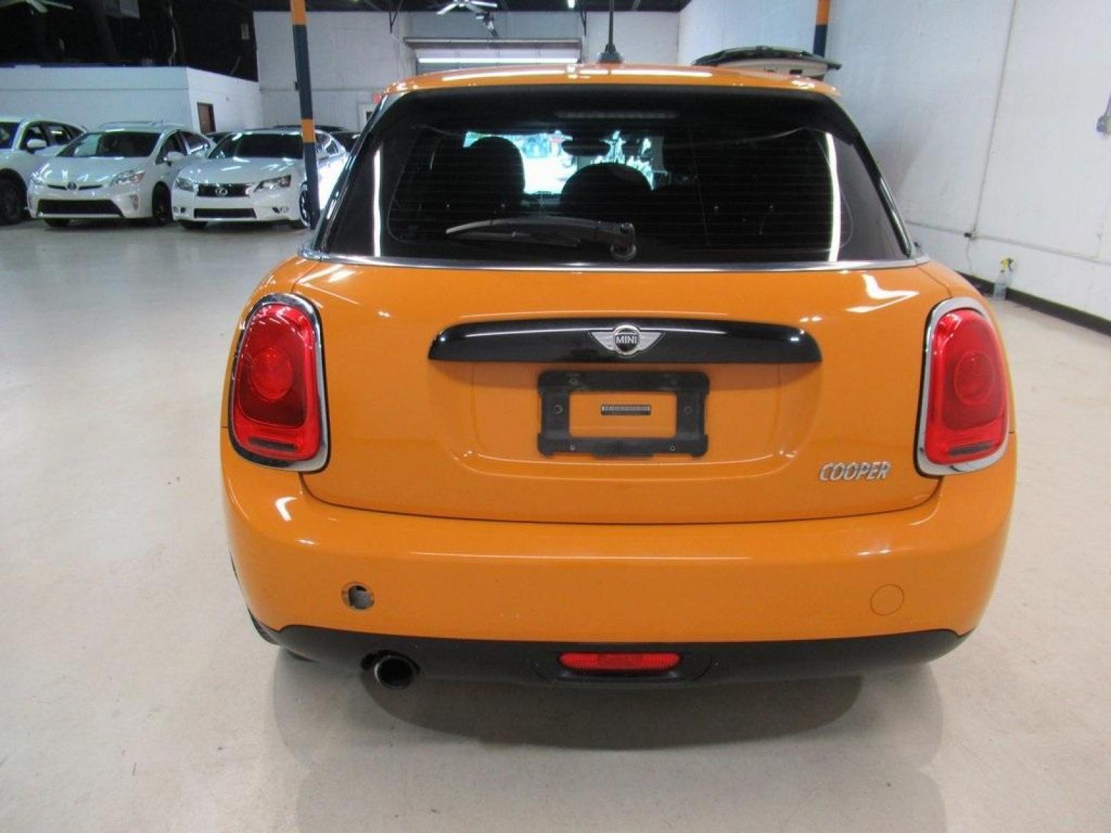 2016 Volcanic Orange /Carbon Black MINI Cooper Base (WMWXU1C51G2) with an 1.5L 12V TwinPower Turbo engine, Automatic transmission, located at 15300 Midway Rd., Addison, 75001, (972) 702-0011, 32.958321, -96.838074 - HOME OF THE NO HAGGLE PRICE - WHOLESALE PRICES TO THE PUBLIC!! 4D Hatchback, 1.5L 12V TwinPower Turbo, 6-Speed Automatic, FWD, Volcanic Orange, Carbon Black Artificial Leather. Odometer is 9768 miles below market average!<br><br>Volcanic Orange 2016 MINI Cooper<br><br>Recent Arrival! 27/37 City/High - Photo #7