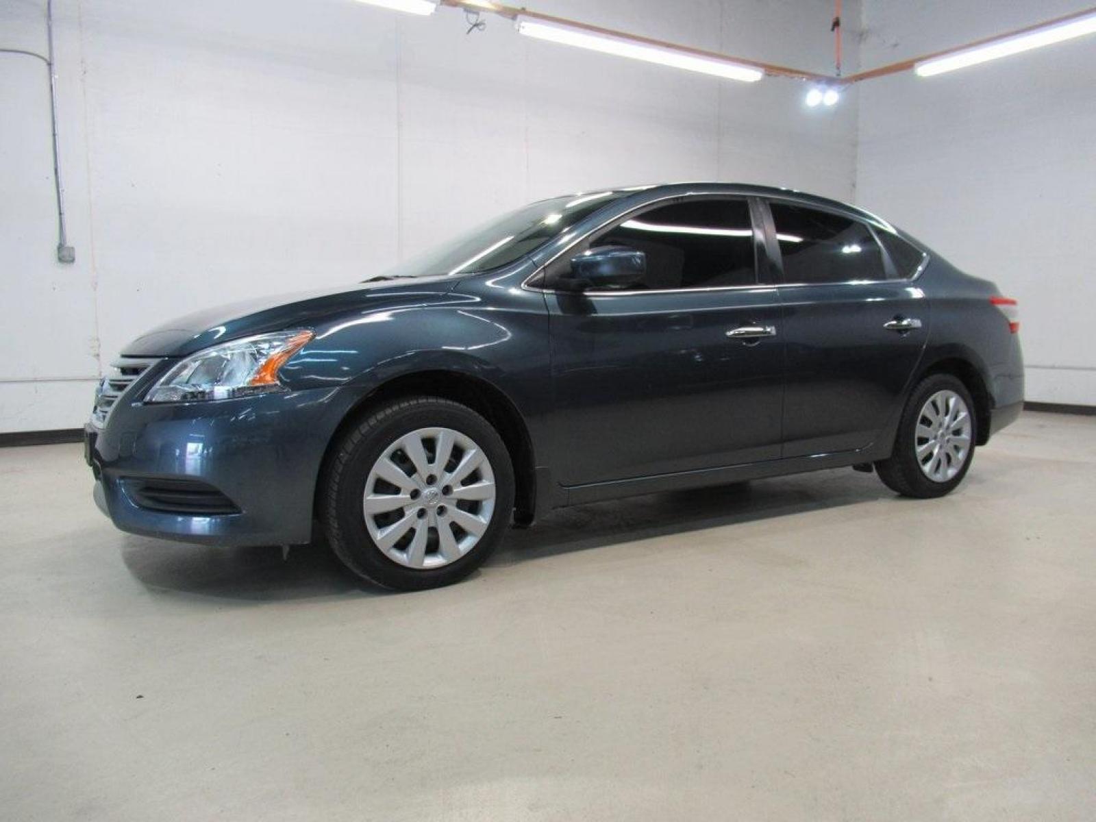 2014 Graphite Blue /Charcoal Nissan Sentra SV (3N1AB7AP7EY) with an 1.8L 4-Cylinder DOHC 16V engine, CVT transmission, located at 15300 Midway Rd., Addison, 75001, (972) 702-0011, 32.958321, -96.838074 - HOME OF THE NO HAGGLE PRICE - WHOLESALE PRICES TO THE PUBLIC!! Sentra SV, 4D Sedan, 1.8L 4-Cylinder DOHC 16V, CVT with Xtronic, FWD, Graphite Blue, Charcoal Cloth. Odometer is 64340 miles below market average!<br><br>Graphite Blue 2014 Nissan Sentra SV<br><br>30/39 City/Highway MPG<br><br>Awards:<br - Photo #4