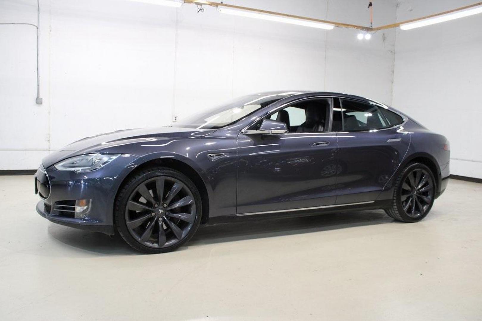 2014 Gray Metallic /Black Tesla Model S P85D (5YJSA1H21EF) with an Electric Motor engine, Automatic transmission, located at 15300 Midway Rd., Addison, TX, 75001, (972) 702-0011, 32.958321, -96.838074 - HOME OF THE NO HAGGLE PRICE - WHOLESALE PRICES TO THE PUBLIC!! Model S P85D, 4D Hatchback, 12-Cylinder Electric ZEV 691hp, 1-Speed Automatic, AWD, Gray, Leather.<br><br>Gray 2014 Tesla Model S P85D<br><br>86/94 City/Highway MPG<br><br><br>At Midway Auto Group, we strive to provide you with the best - Photo#3