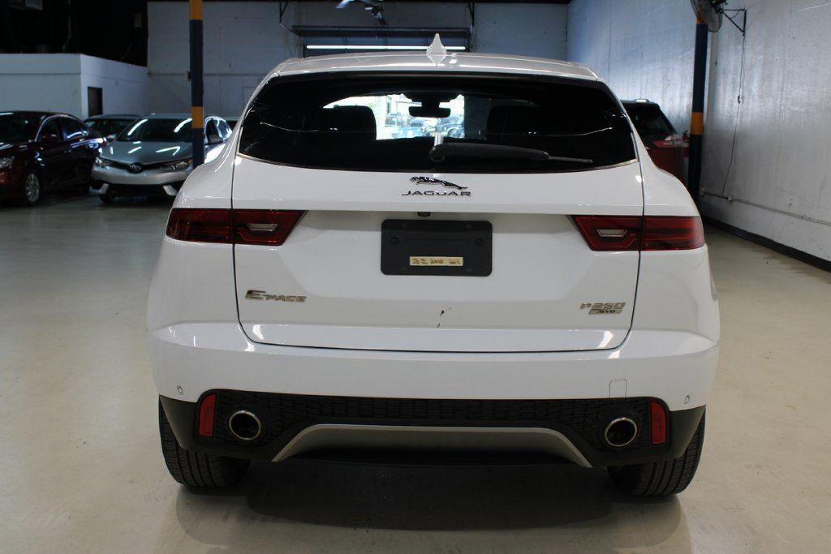 2018 Fuji White /Ebony/Ebony Jaguar E-PACE S (SADFJ2FX2J1) with an 2.0L I4 Turbocharged engine, Automatic transmission, located at 15300 Midway Rd., Addison, TX, 75001, (972) 702-0011, 32.958321, -96.838074 - HOME OF THE NO HAGGLE PRICE - WHOLESALE PRICES TO THE PUBLIC!! non smoker, E-PACE S, 4D Sport Utility, 2.0L I4 Turbocharged, 9-Speed Automatic, AWD, White, Ebony/Ebony Leather.<br><br>White 2018 Jaguar E-PACE S<br><br>21/28 City/Highway MPG<br><br>Awards:<br> * 2018 KBB.com Brand Image Awards<br><b - Photo#7