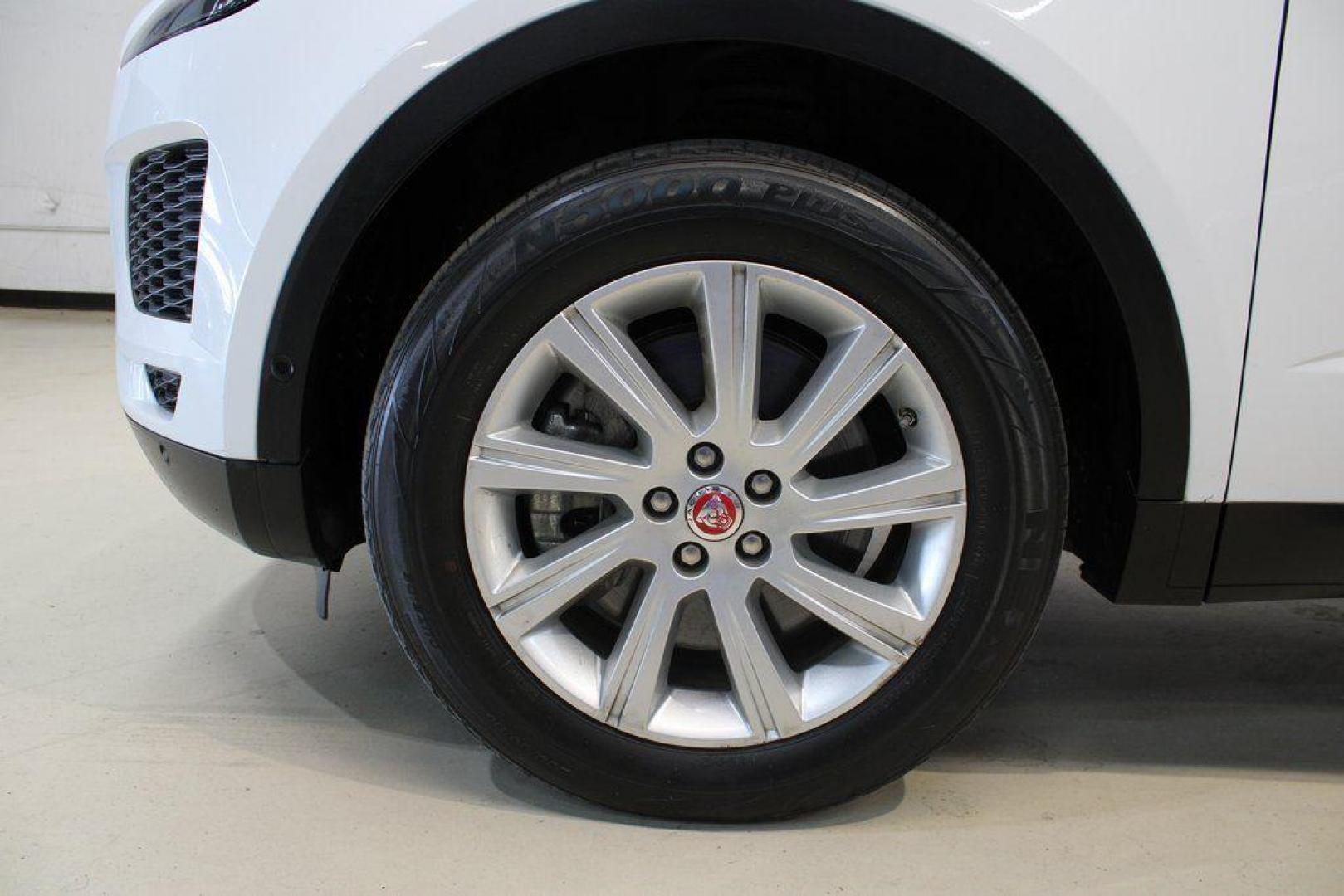 2018 Fuji White /Ebony/Ebony Jaguar E-PACE S (SADFJ2FX2J1) with an 2.0L I4 Turbocharged engine, Automatic transmission, located at 15300 Midway Rd., Addison, TX, 75001, (972) 702-0011, 32.958321, -96.838074 - HOME OF THE NO HAGGLE PRICE - WHOLESALE PRICES TO THE PUBLIC!! non smoker, E-PACE S, 4D Sport Utility, 2.0L I4 Turbocharged, 9-Speed Automatic, AWD, White, Ebony/Ebony Leather.<br><br>White 2018 Jaguar E-PACE S<br><br>21/28 City/Highway MPG<br><br>Awards:<br> * 2018 KBB.com Brand Image Awards<br><b - Photo#9