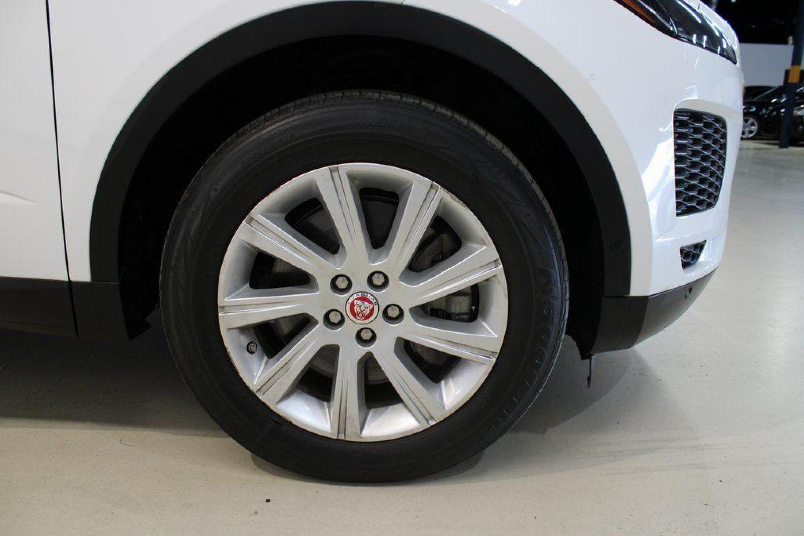 2018 Fuji White /Ebony/Ebony Jaguar E-PACE S (SADFJ2FX2J1) with an 2.0L I4 Turbocharged engine, Automatic transmission, located at 15300 Midway Rd., Addison, TX, 75001, (972) 702-0011, 32.958321, -96.838074 - HOME OF THE NO HAGGLE PRICE - WHOLESALE PRICES TO THE PUBLIC!! non smoker, E-PACE S, 4D Sport Utility, 2.0L I4 Turbocharged, 9-Speed Automatic, AWD, White, Ebony/Ebony Leather.<br><br>White 2018 Jaguar E-PACE S<br><br>21/28 City/Highway MPG<br><br>Awards:<br> * 2018 KBB.com Brand Image Awards<br><b - Photo#12