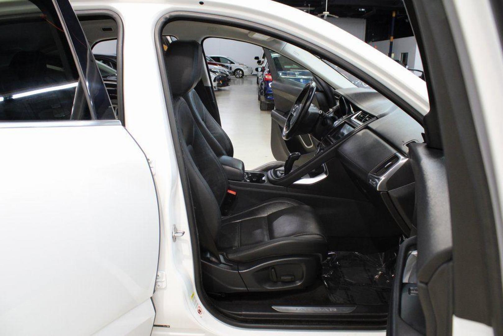 2018 Fuji White /Ebony/Ebony Jaguar E-PACE S (SADFJ2FX2J1) with an 2.0L I4 Turbocharged engine, Automatic transmission, located at 15300 Midway Rd., Addison, TX, 75001, (972) 702-0011, 32.958321, -96.838074 - HOME OF THE NO HAGGLE PRICE - WHOLESALE PRICES TO THE PUBLIC!! non smoker, E-PACE S, 4D Sport Utility, 2.0L I4 Turbocharged, 9-Speed Automatic, AWD, White, Ebony/Ebony Leather.<br><br>White 2018 Jaguar E-PACE S<br><br>21/28 City/Highway MPG<br><br>Awards:<br> * 2018 KBB.com Brand Image Awards<br><b - Photo#15
