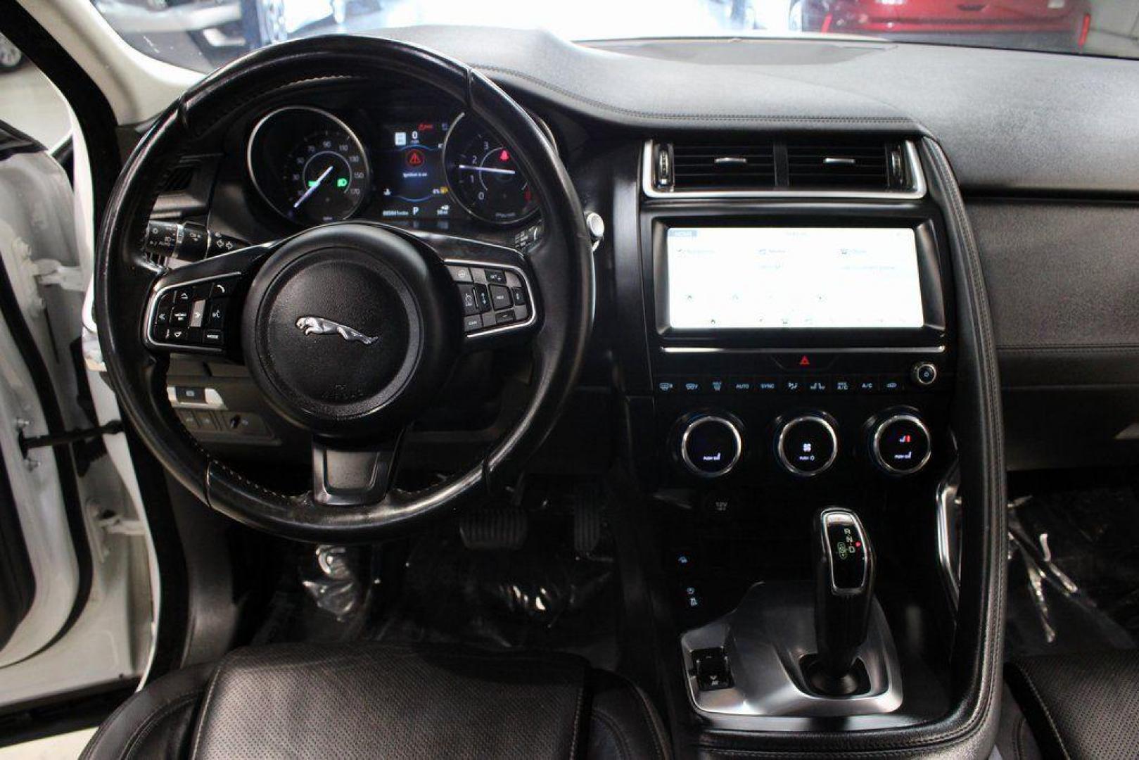 2018 Fuji White /Ebony/Ebony Jaguar E-PACE S (SADFJ2FX2J1) with an 2.0L I4 Turbocharged engine, Automatic transmission, located at 15300 Midway Rd., Addison, TX, 75001, (972) 702-0011, 32.958321, -96.838074 - HOME OF THE NO HAGGLE PRICE - WHOLESALE PRICES TO THE PUBLIC!! non smoker, E-PACE S, 4D Sport Utility, 2.0L I4 Turbocharged, 9-Speed Automatic, AWD, White, Ebony/Ebony Leather.<br><br>White 2018 Jaguar E-PACE S<br><br>21/28 City/Highway MPG<br><br>Awards:<br> * 2018 KBB.com Brand Image Awards<br><b - Photo#18