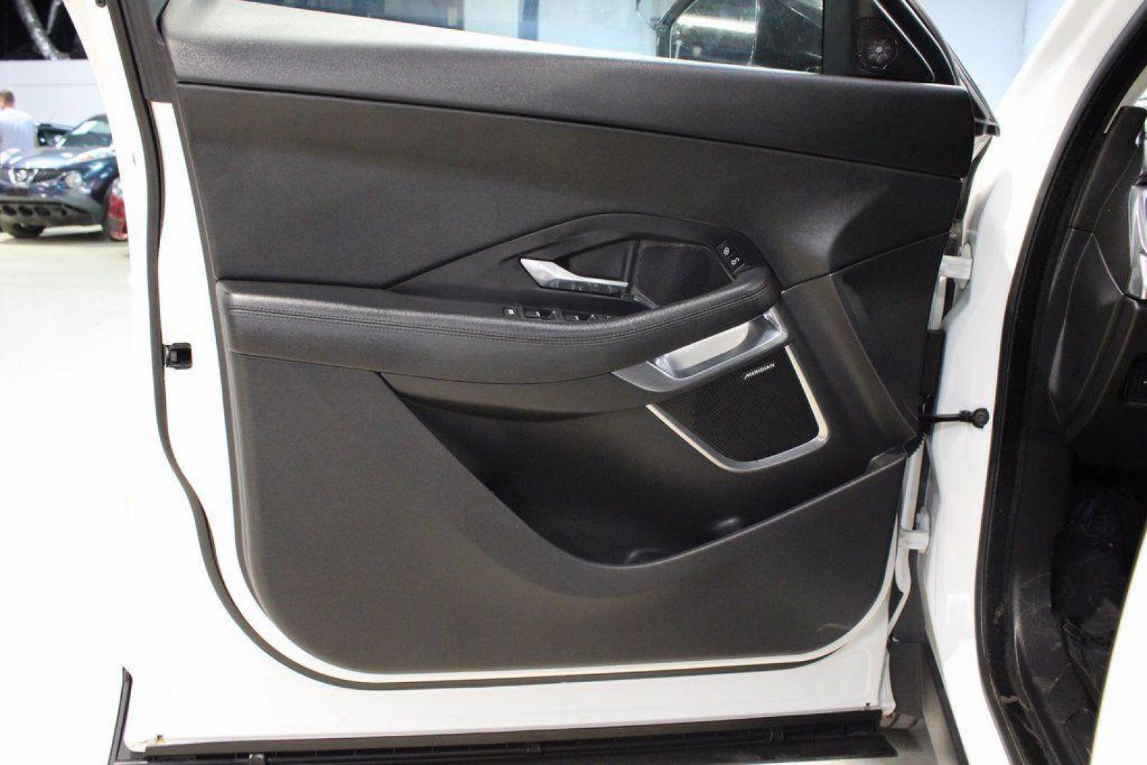2018 Fuji White /Ebony/Ebony Jaguar E-PACE S (SADFJ2FX2J1) with an 2.0L I4 Turbocharged engine, Automatic transmission, located at 15300 Midway Rd., Addison, TX, 75001, (972) 702-0011, 32.958321, -96.838074 - HOME OF THE NO HAGGLE PRICE - WHOLESALE PRICES TO THE PUBLIC!! non smoker, E-PACE S, 4D Sport Utility, 2.0L I4 Turbocharged, 9-Speed Automatic, AWD, White, Ebony/Ebony Leather.<br><br>White 2018 Jaguar E-PACE S<br><br>21/28 City/Highway MPG<br><br>Awards:<br> * 2018 KBB.com Brand Image Awards<br><b - Photo#30