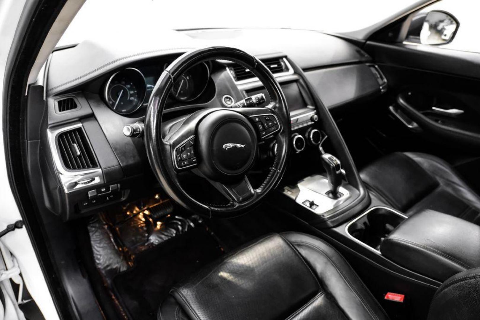 2018 Fuji White /Ebony/Ebony Jaguar E-PACE S (SADFJ2FX2J1) with an 2.0L I4 Turbocharged engine, Automatic transmission, located at 15300 Midway Rd., Addison, TX, 75001, (972) 702-0011, 32.958321, -96.838074 - HOME OF THE NO HAGGLE PRICE - WHOLESALE PRICES TO THE PUBLIC!! non smoker, E-PACE S, 4D Sport Utility, 2.0L I4 Turbocharged, 9-Speed Automatic, AWD, White, Ebony/Ebony Leather.<br><br>White 2018 Jaguar E-PACE S<br><br>21/28 City/Highway MPG<br><br>Awards:<br> * 2018 KBB.com Brand Image Awards<br><b - Photo#2