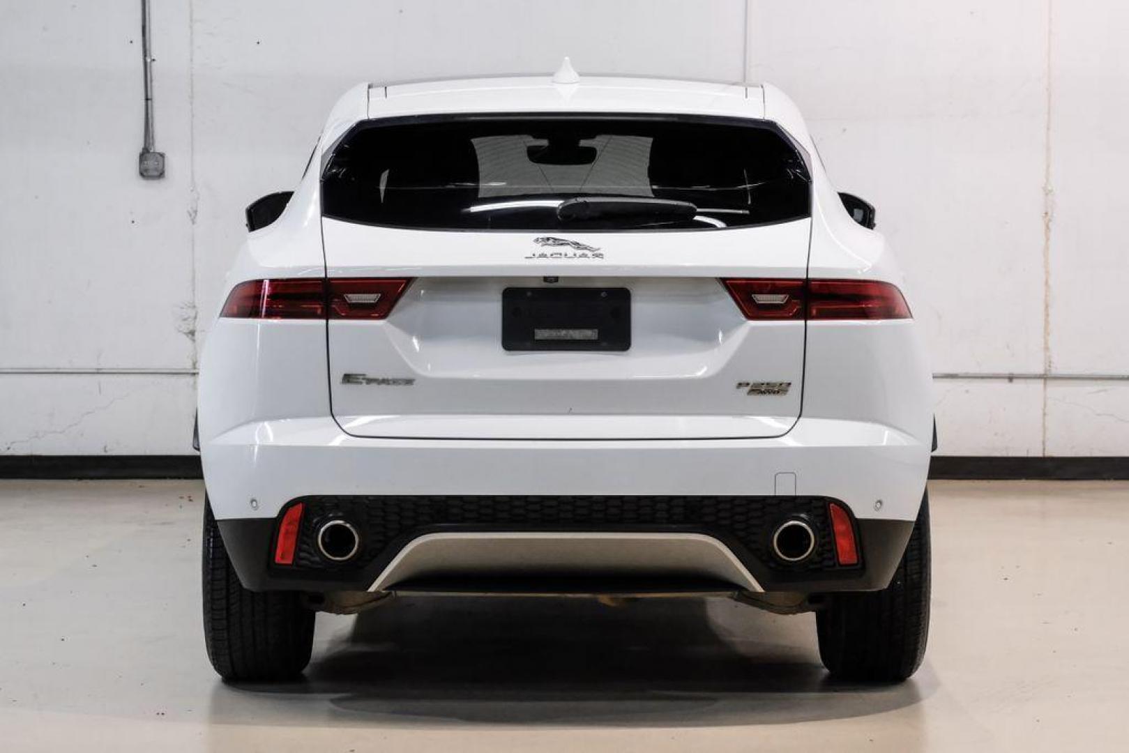 2018 Fuji White /Ebony/Ebony Jaguar E-PACE S (SADFJ2FX2J1) with an 2.0L I4 Turbocharged engine, Automatic transmission, located at 15300 Midway Rd., Addison, TX, 75001, (972) 702-0011, 32.958321, -96.838074 - HOME OF THE NO HAGGLE PRICE - WHOLESALE PRICES TO THE PUBLIC!! non smoker, E-PACE S, 4D Sport Utility, 2.0L I4 Turbocharged, 9-Speed Automatic, AWD, White, Ebony/Ebony Leather.<br><br>White 2018 Jaguar E-PACE S<br><br>21/28 City/Highway MPG<br><br>Awards:<br> * 2018 KBB.com Brand Image Awards<br><b - Photo#9