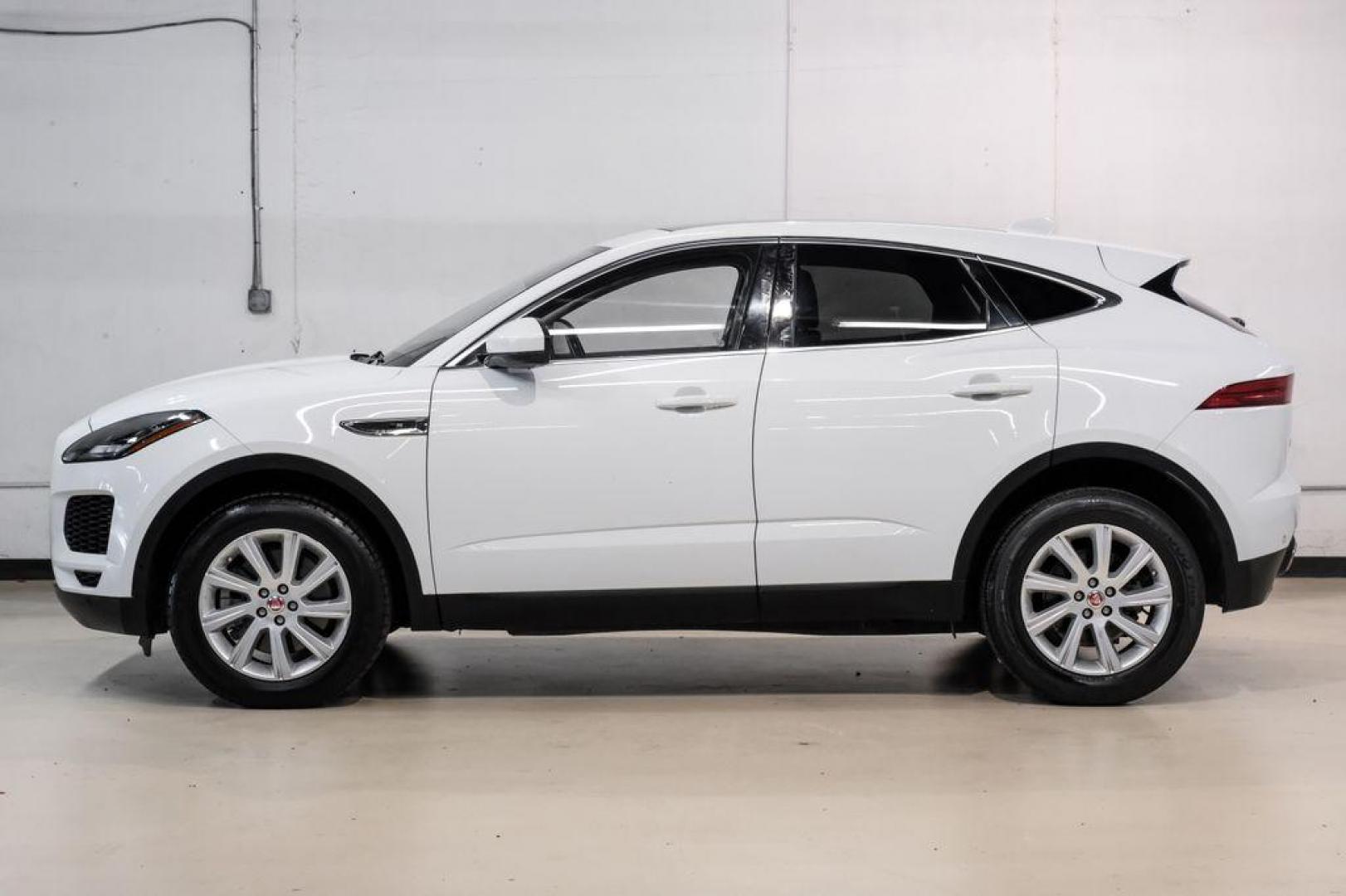 2018 Fuji White /Ebony/Ebony Jaguar E-PACE S (SADFJ2FX2J1) with an 2.0L I4 Turbocharged engine, Automatic transmission, located at 15300 Midway Rd., Addison, TX, 75001, (972) 702-0011, 32.958321, -96.838074 - HOME OF THE NO HAGGLE PRICE - WHOLESALE PRICES TO THE PUBLIC!! non smoker, E-PACE S, 4D Sport Utility, 2.0L I4 Turbocharged, 9-Speed Automatic, AWD, White, Ebony/Ebony Leather.<br><br>White 2018 Jaguar E-PACE S<br><br>21/28 City/Highway MPG<br><br>Awards:<br> * 2018 KBB.com Brand Image Awards<br><b - Photo#11
