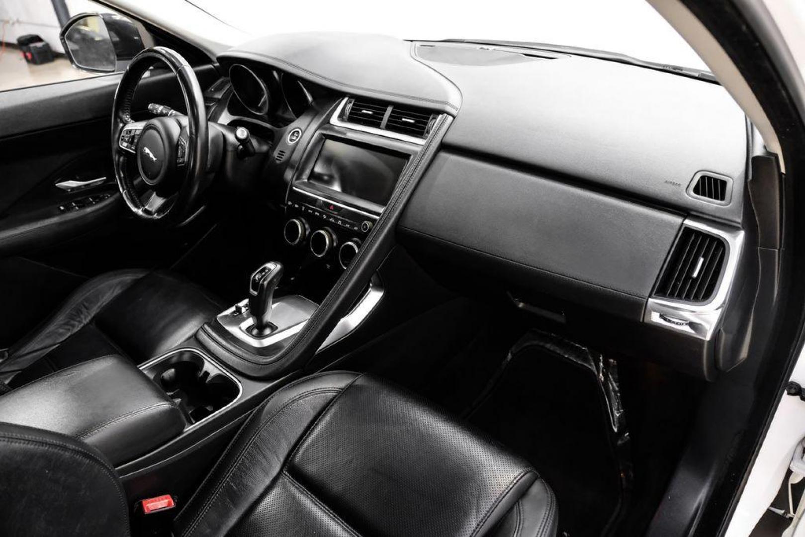2018 Fuji White /Ebony/Ebony Jaguar E-PACE S (SADFJ2FX2J1) with an 2.0L I4 Turbocharged engine, Automatic transmission, located at 15300 Midway Rd., Addison, TX, 75001, (972) 702-0011, 32.958321, -96.838074 - HOME OF THE NO HAGGLE PRICE - WHOLESALE PRICES TO THE PUBLIC!! non smoker, E-PACE S, 4D Sport Utility, 2.0L I4 Turbocharged, 9-Speed Automatic, AWD, White, Ebony/Ebony Leather.<br><br>White 2018 Jaguar E-PACE S<br><br>21/28 City/Highway MPG<br><br>Awards:<br> * 2018 KBB.com Brand Image Awards<br><b - Photo#12