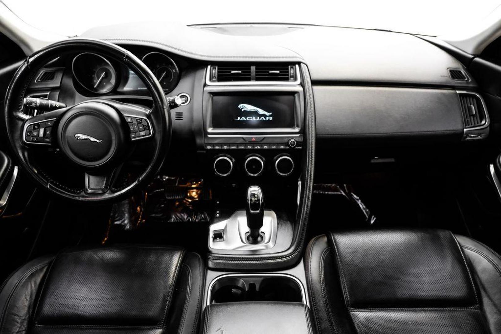 2018 Fuji White /Ebony/Ebony Jaguar E-PACE S (SADFJ2FX2J1) with an 2.0L I4 Turbocharged engine, Automatic transmission, located at 15300 Midway Rd., Addison, TX, 75001, (972) 702-0011, 32.958321, -96.838074 - HOME OF THE NO HAGGLE PRICE - WHOLESALE PRICES TO THE PUBLIC!! non smoker, E-PACE S, 4D Sport Utility, 2.0L I4 Turbocharged, 9-Speed Automatic, AWD, White, Ebony/Ebony Leather.<br><br>White 2018 Jaguar E-PACE S<br><br>21/28 City/Highway MPG<br><br>Awards:<br> * 2018 KBB.com Brand Image Awards<br><b - Photo#13