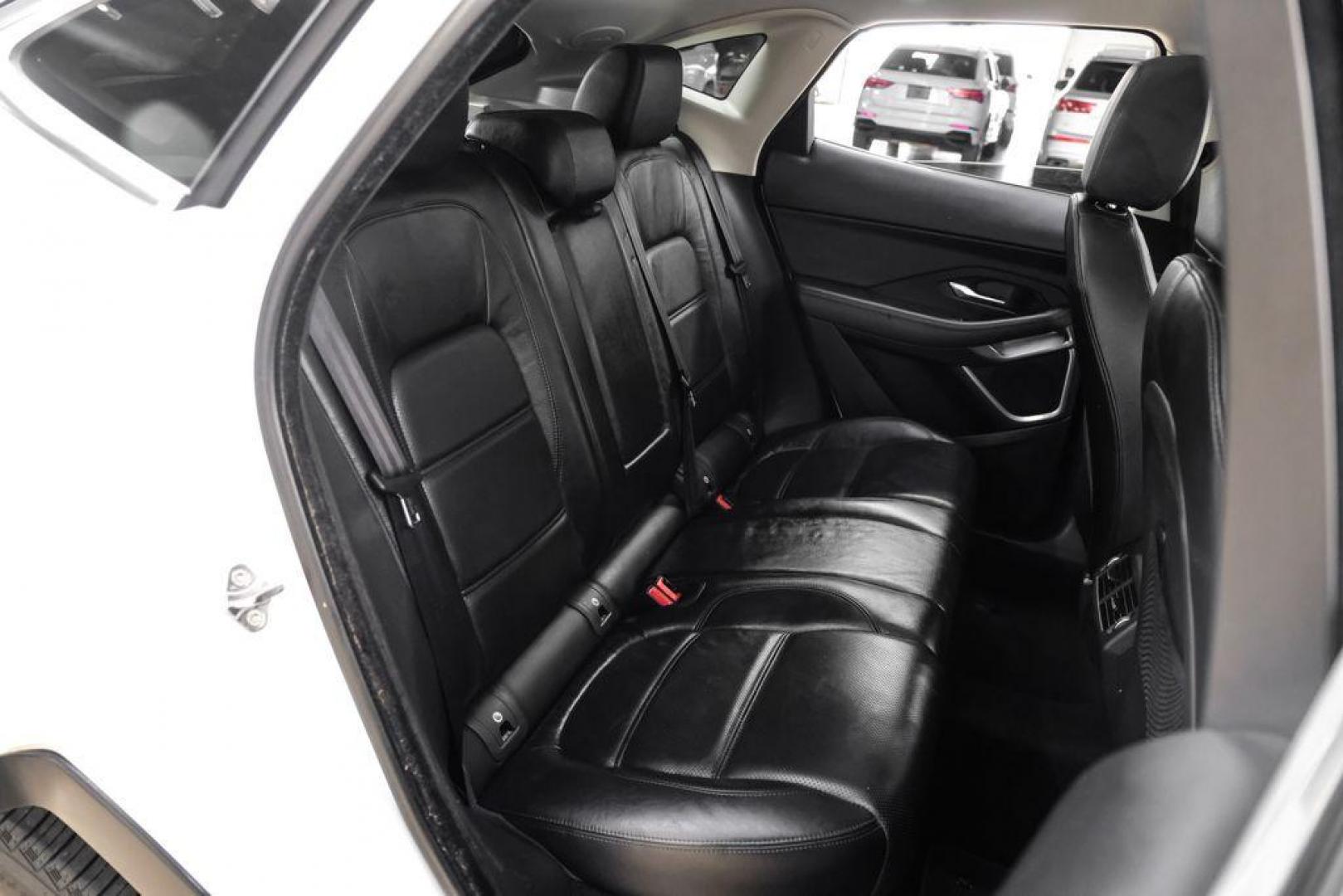 2018 Fuji White /Ebony/Ebony Jaguar E-PACE S (SADFJ2FX2J1) with an 2.0L I4 Turbocharged engine, Automatic transmission, located at 15300 Midway Rd., Addison, TX, 75001, (972) 702-0011, 32.958321, -96.838074 - HOME OF THE NO HAGGLE PRICE - WHOLESALE PRICES TO THE PUBLIC!! non smoker, E-PACE S, 4D Sport Utility, 2.0L I4 Turbocharged, 9-Speed Automatic, AWD, White, Ebony/Ebony Leather.<br><br>White 2018 Jaguar E-PACE S<br><br>21/28 City/Highway MPG<br><br>Awards:<br> * 2018 KBB.com Brand Image Awards<br><b - Photo#33