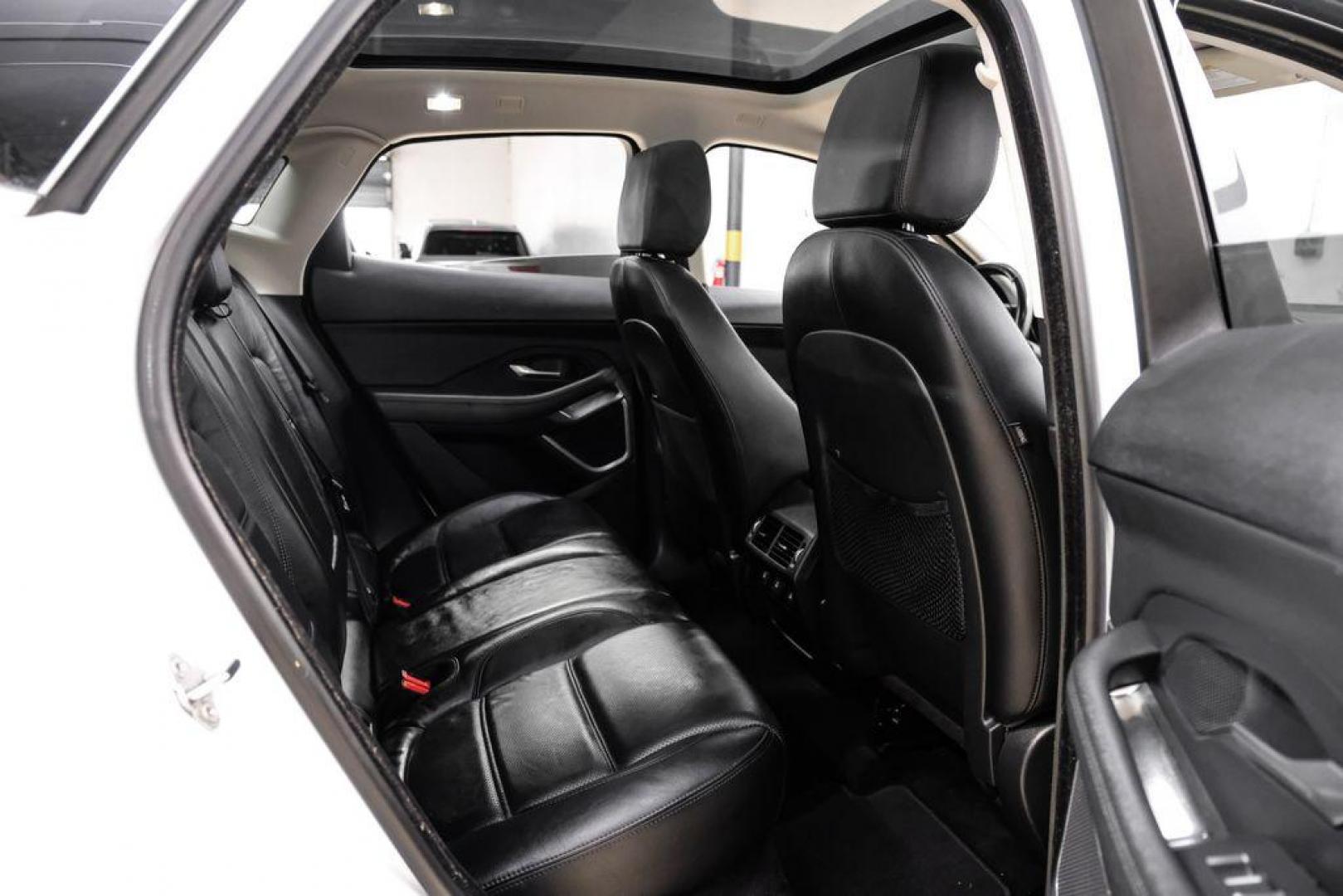 2018 Fuji White /Ebony/Ebony Jaguar E-PACE S (SADFJ2FX2J1) with an 2.0L I4 Turbocharged engine, Automatic transmission, located at 15300 Midway Rd., Addison, TX, 75001, (972) 702-0011, 32.958321, -96.838074 - HOME OF THE NO HAGGLE PRICE - WHOLESALE PRICES TO THE PUBLIC!! non smoker, E-PACE S, 4D Sport Utility, 2.0L I4 Turbocharged, 9-Speed Automatic, AWD, White, Ebony/Ebony Leather.<br><br>White 2018 Jaguar E-PACE S<br><br>21/28 City/Highway MPG<br><br>Awards:<br> * 2018 KBB.com Brand Image Awards<br><b - Photo#34