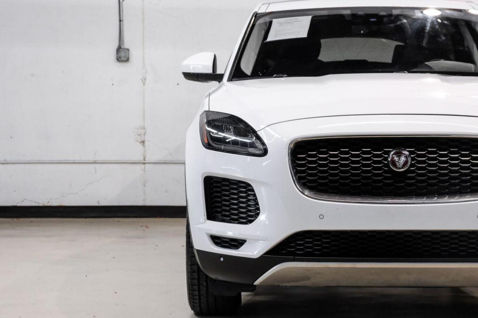 2018 Fuji White /Ebony/Ebony Jaguar E-PACE S (SADFJ2FX2J1) with an 2.0L I4 Turbocharged engine, Automatic transmission, located at 15300 Midway Rd., Addison, TX, 75001, (972) 702-0011, 32.958321, -96.838074 - HOME OF THE NO HAGGLE PRICE - WHOLESALE PRICES TO THE PUBLIC!! non smoker, E-PACE S, 4D Sport Utility, 2.0L I4 Turbocharged, 9-Speed Automatic, AWD, White, Ebony/Ebony Leather.<br><br>White 2018 Jaguar E-PACE S<br><br>21/28 City/Highway MPG<br><br>Awards:<br> * 2018 KBB.com Brand Image Awards<br><b - Photo#38