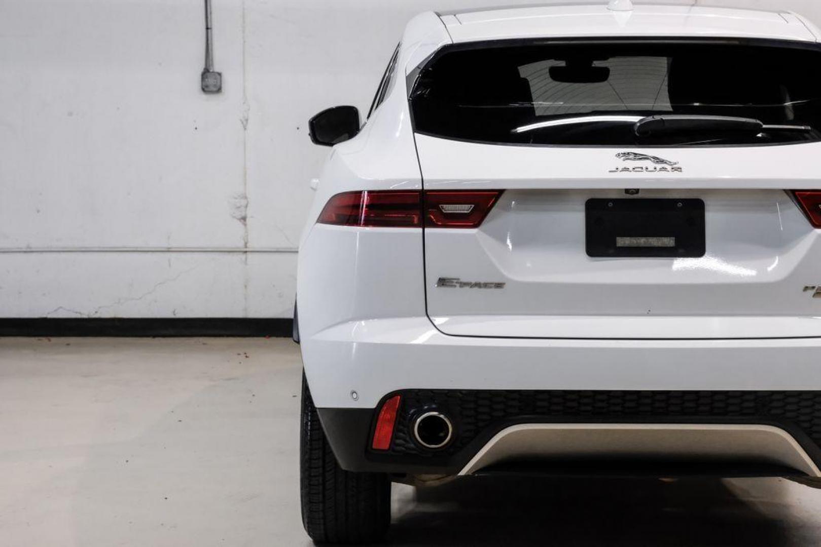 2018 Fuji White /Ebony/Ebony Jaguar E-PACE S (SADFJ2FX2J1) with an 2.0L I4 Turbocharged engine, Automatic transmission, located at 15300 Midway Rd., Addison, TX, 75001, (972) 702-0011, 32.958321, -96.838074 - HOME OF THE NO HAGGLE PRICE - WHOLESALE PRICES TO THE PUBLIC!! non smoker, E-PACE S, 4D Sport Utility, 2.0L I4 Turbocharged, 9-Speed Automatic, AWD, White, Ebony/Ebony Leather.<br><br>White 2018 Jaguar E-PACE S<br><br>21/28 City/Highway MPG<br><br>Awards:<br> * 2018 KBB.com Brand Image Awards<br><b - Photo#39