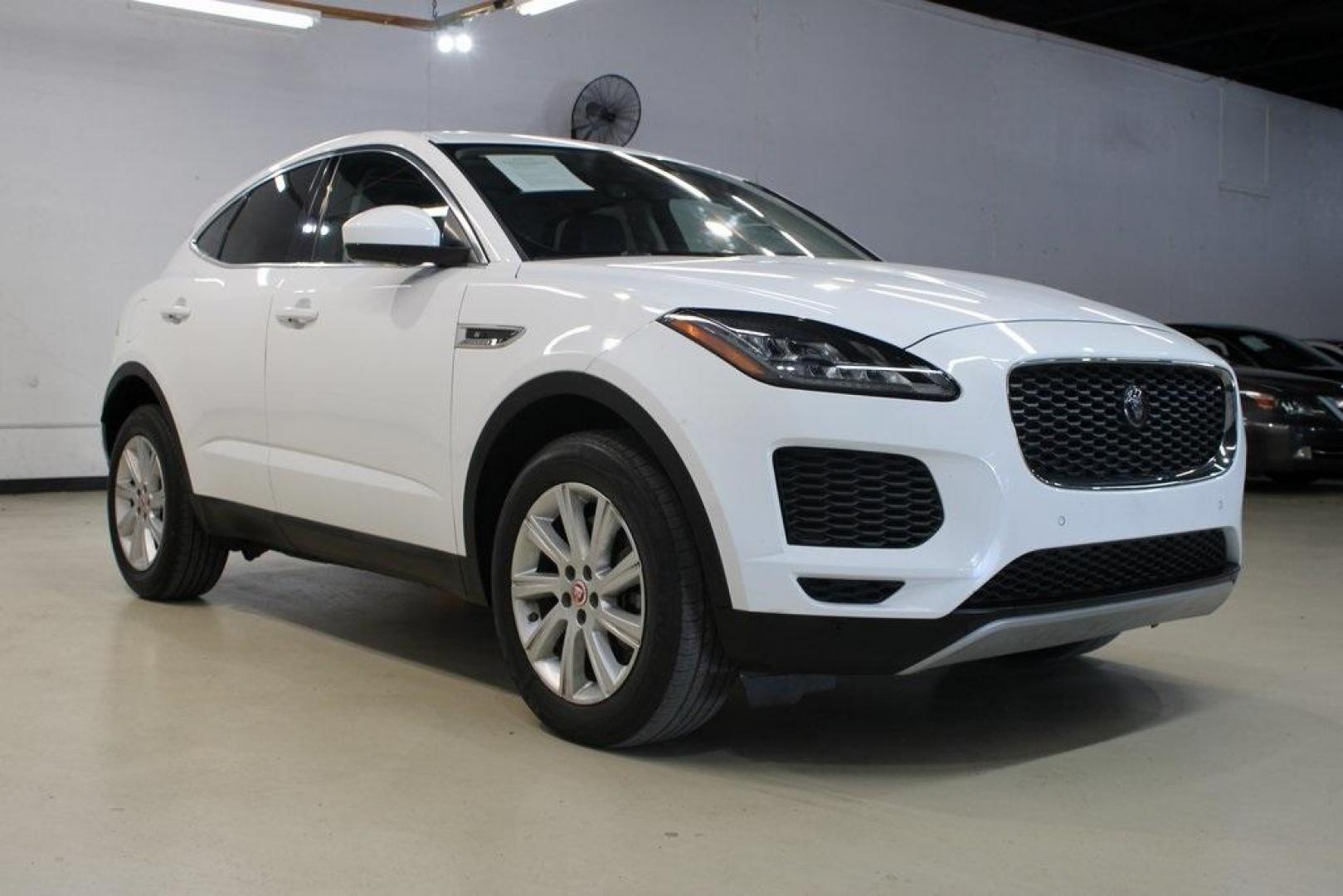 2018 Fuji White /Ebony/Ebony Jaguar E-PACE S (SADFJ2FX2J1) with an 2.0L I4 Turbocharged engine, Automatic transmission, located at 15300 Midway Rd., Addison, TX, 75001, (972) 702-0011, 32.958321, -96.838074 - HOME OF THE NO HAGGLE PRICE - WHOLESALE PRICES TO THE PUBLIC!! non smoker, E-PACE S, 4D Sport Utility, 2.0L I4 Turbocharged, 9-Speed Automatic, AWD, White, Ebony/Ebony Leather.<br><br>White 2018 Jaguar E-PACE S<br><br>21/28 City/Highway MPG<br><br>Awards:<br> * 2018 KBB.com Brand Image Awards<br><b - Photo#1