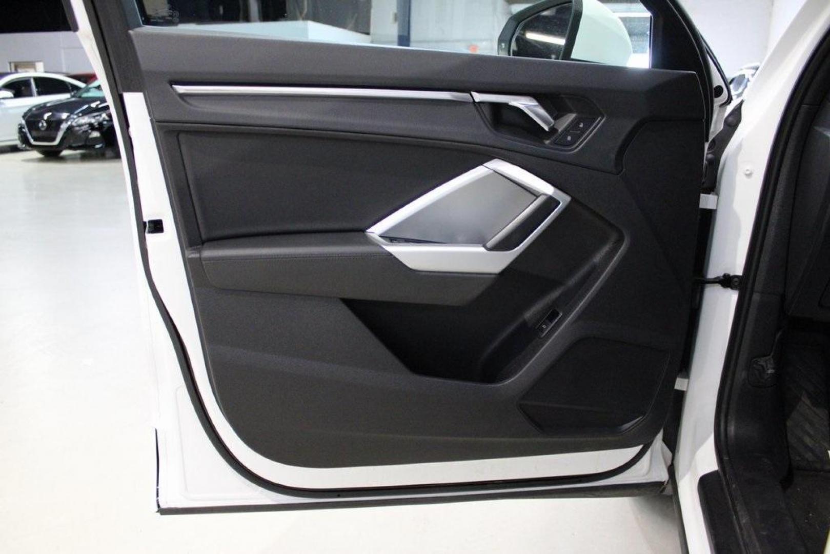 2020 White /Black Audi Q3 Premium (WA1AECF34L1) with an 2.0L 4-Cylinder TFSI engine, Automatic transmission, located at 15300 Midway Rd., Addison, TX, 75001, (972) 702-0011, 32.958321, -96.838074 - HOME OF THE NO HAGGLE PRICE - WHOLESALE PRICES TO THE PUBLIC!! Q3 Premium quattro, 4D Sport Utility, 2.0L 4-Cylinder TFSI, 8-Speed Automatic with Tiptronic, quattro, White, Leather.<br><br>White 2020 Audi Q3 Premium<br><br>19/27 City/Highway MPG<br><br>Awards:<br> * 2020 KBB.com Best Buy Awards<br> - Photo#29