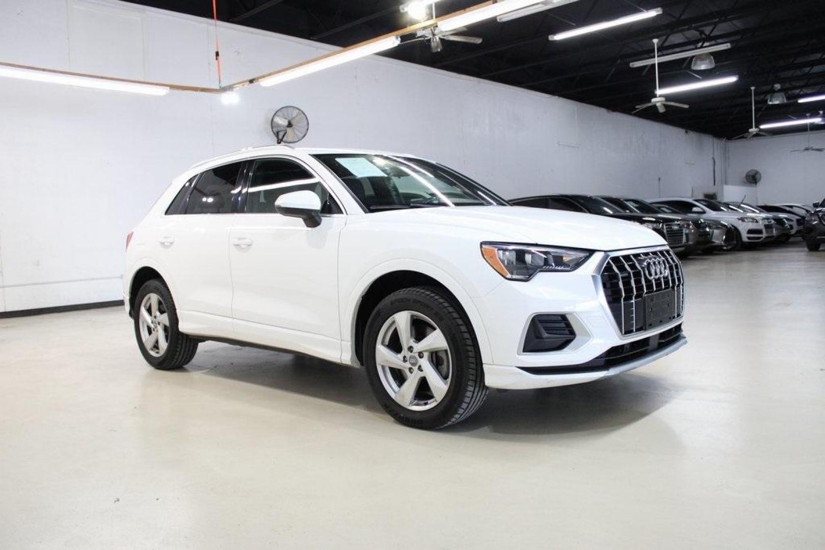 2020 White /Black Audi Q3 Premium (WA1AECF34L1) with an 2.0L 4-Cylinder TFSI engine, Automatic transmission, located at 15300 Midway Rd., Addison, TX, 75001, (972) 702-0011, 32.958321, -96.838074 - HOME OF THE NO HAGGLE PRICE - WHOLESALE PRICES TO THE PUBLIC!! Q3 Premium quattro, 4D Sport Utility, 2.0L 4-Cylinder TFSI, 8-Speed Automatic with Tiptronic, quattro, White, Leather.<br><br>White 2020 Audi Q3 Premium<br><br>19/27 City/Highway MPG<br><br>Awards:<br> * 2020 KBB.com Best Buy Awards<br> - Photo#6
