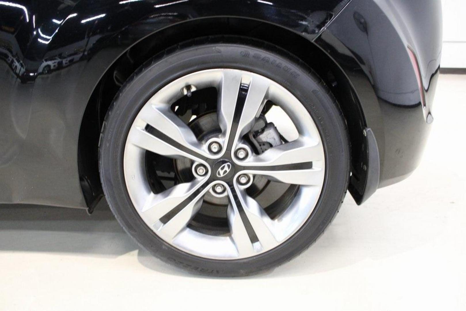 2012 Ultra Black /Gray Hyundai Veloster Base (KMHTC6ADXCU) with an 1.6L 4-Cylinder DGI DOHC engine, Automatic transmission, located at 15300 Midway Rd., Addison, TX, 75001, (972) 702-0011, 32.958321, -96.838074 - Introducing the 2012 Hyundai Veloster, now available at Midway Auto Group in Addison, Texas. This innovative hatchback combines sporty design, advanced technology, and impressive fuel efficiency, making it an excellent choice for drivers seeking both style and practicality.<br><br>Key Features:<br>< - Photo#9