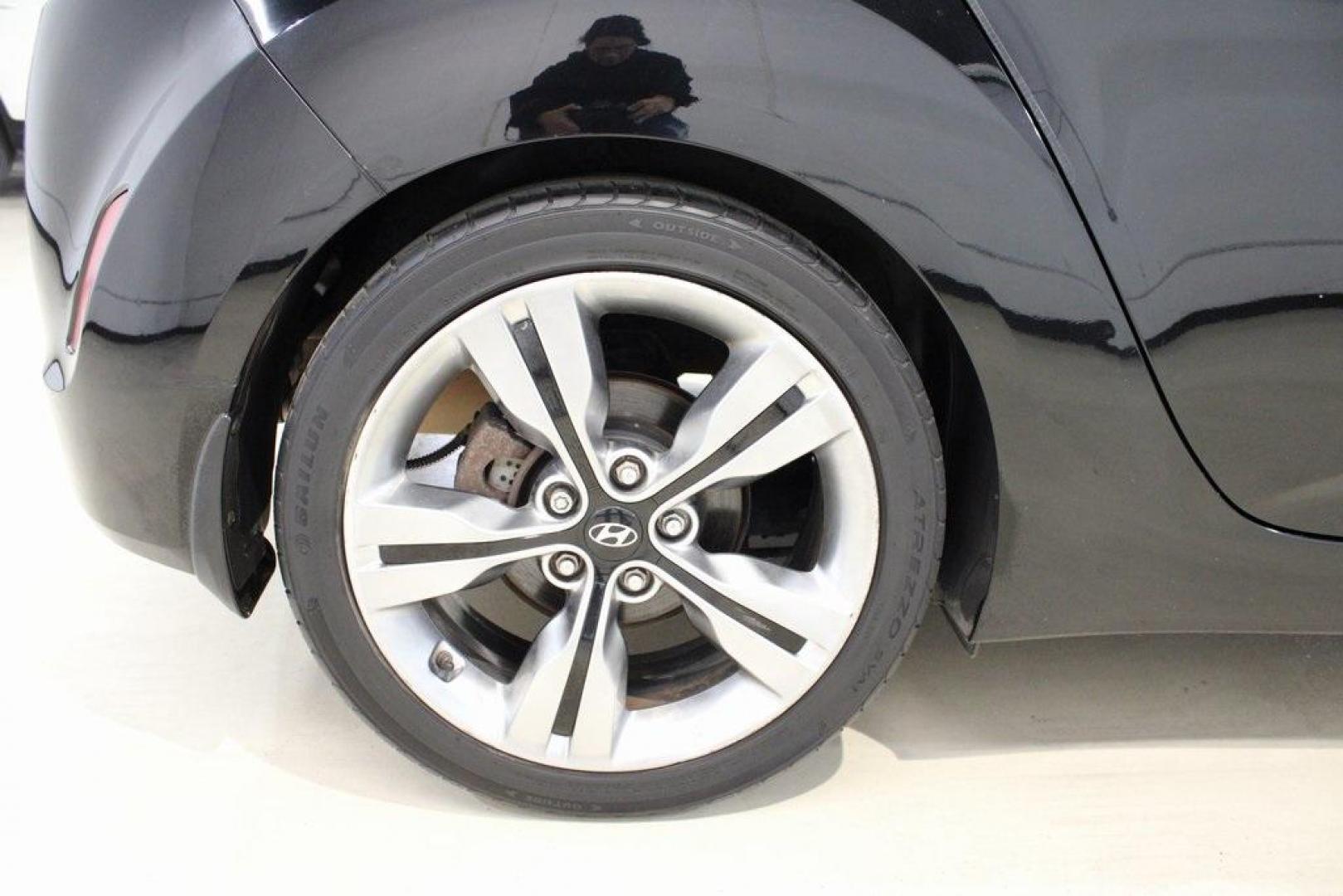 2012 Ultra Black /Gray Hyundai Veloster Base (KMHTC6ADXCU) with an 1.6L 4-Cylinder DGI DOHC engine, Automatic transmission, located at 15300 Midway Rd., Addison, TX, 75001, (972) 702-0011, 32.958321, -96.838074 - Introducing the 2012 Hyundai Veloster, now available at Midway Auto Group in Addison, Texas. This innovative hatchback combines sporty design, advanced technology, and impressive fuel efficiency, making it an excellent choice for drivers seeking both style and practicality.<br><br>Key Features:<br>< - Photo#10