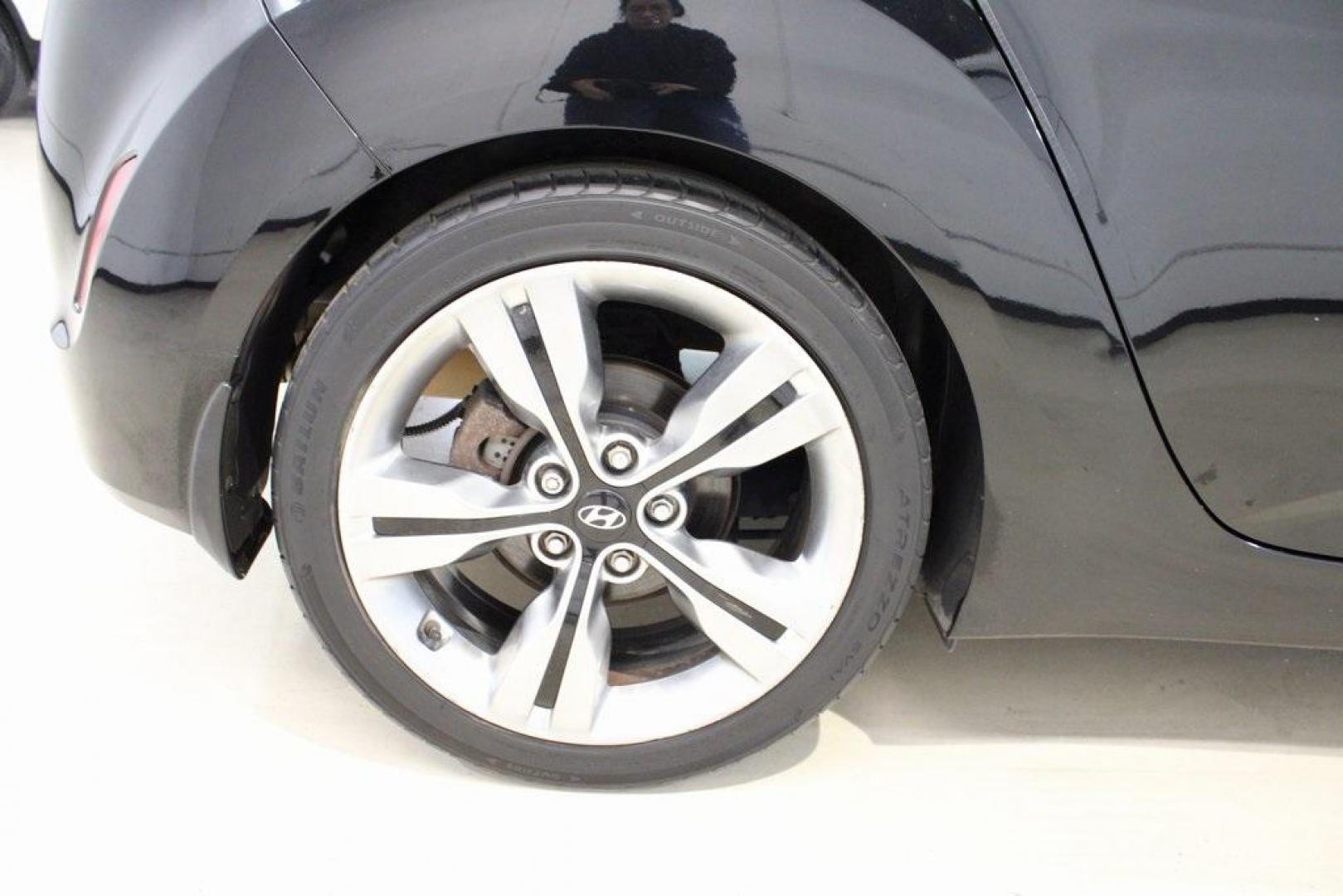 2012 Ultra Black /Gray Hyundai Veloster Base (KMHTC6ADXCU) with an 1.6L 4-Cylinder DGI DOHC engine, Automatic transmission, located at 15300 Midway Rd., Addison, TX, 75001, (972) 702-0011, 32.958321, -96.838074 - Introducing the 2012 Hyundai Veloster, now available at Midway Auto Group in Addison, Texas. This innovative hatchback combines sporty design, advanced technology, and impressive fuel efficiency, making it an excellent choice for drivers seeking both style and practicality.<br><br>Key Features:<br>< - Photo#11