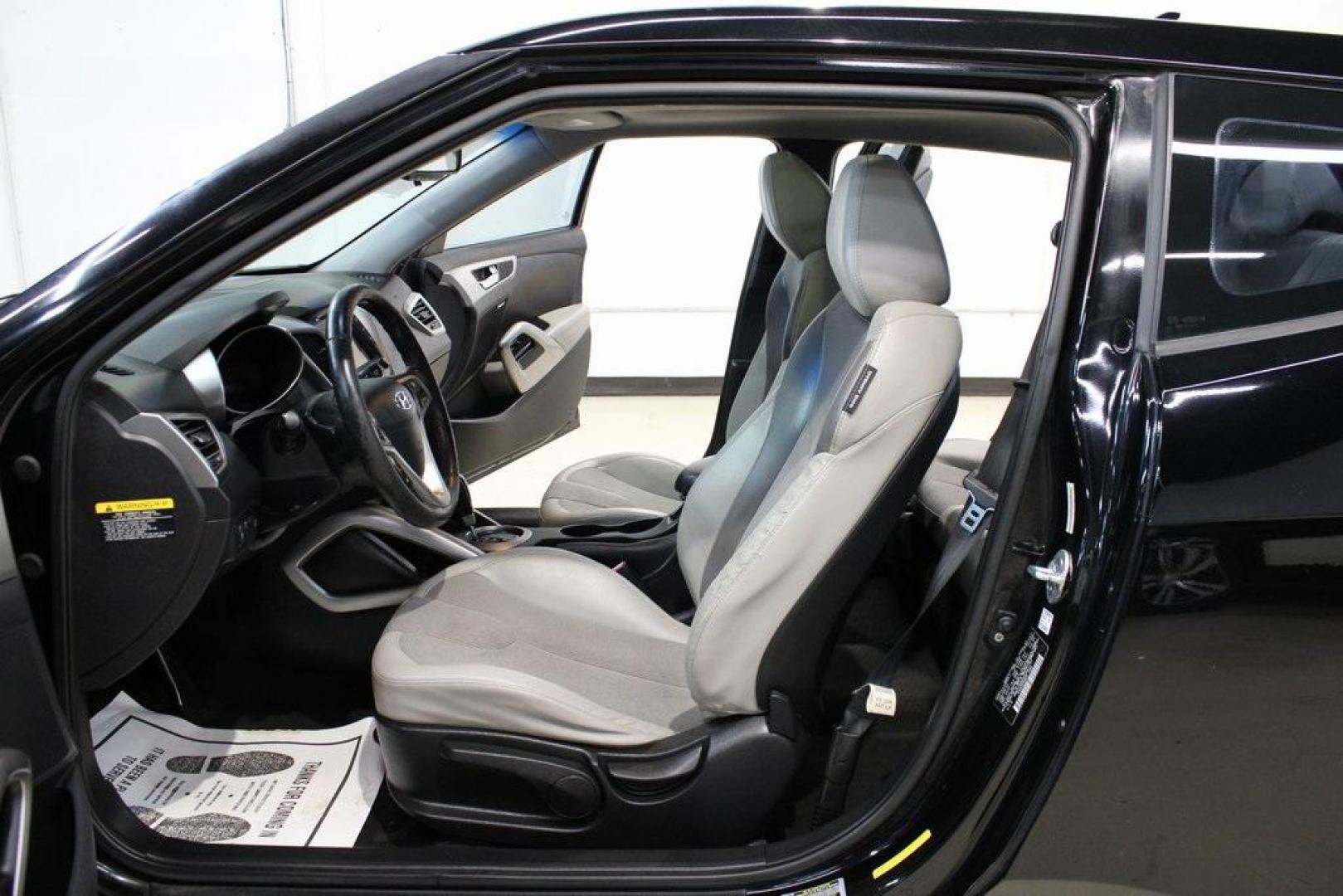 2012 Ultra Black /Gray Hyundai Veloster Base (KMHTC6ADXCU) with an 1.6L 4-Cylinder DGI DOHC engine, Automatic transmission, located at 15300 Midway Rd., Addison, TX, 75001, (972) 702-0011, 32.958321, -96.838074 - Introducing the 2012 Hyundai Veloster, now available at Midway Auto Group in Addison, Texas. This innovative hatchback combines sporty design, advanced technology, and impressive fuel efficiency, making it an excellent choice for drivers seeking both style and practicality.<br><br>Key Features:<br>< - Photo#14
