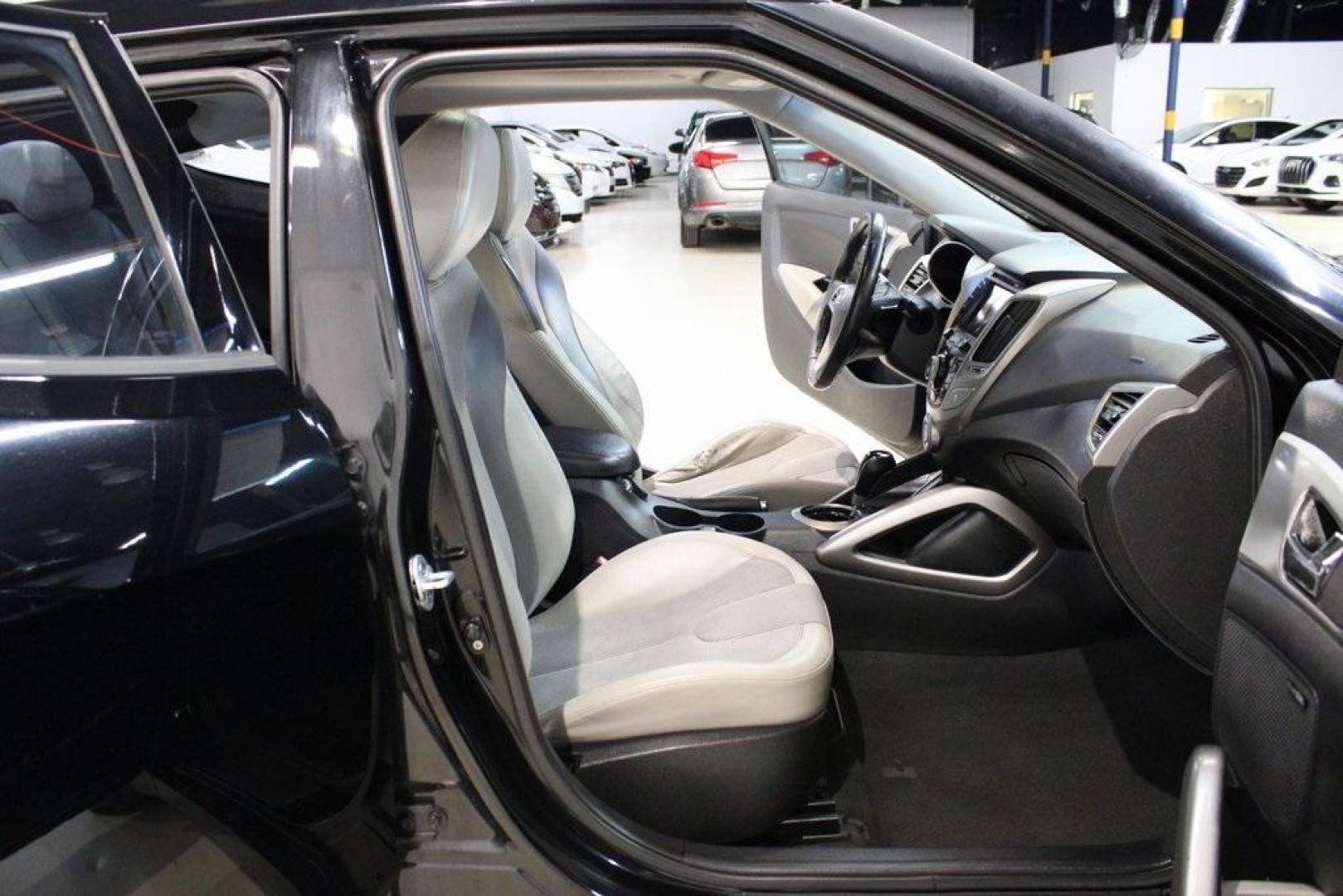 2012 Ultra Black /Gray Hyundai Veloster Base (KMHTC6ADXCU) with an 1.6L 4-Cylinder DGI DOHC engine, Automatic transmission, located at 15300 Midway Rd., Addison, TX, 75001, (972) 702-0011, 32.958321, -96.838074 - Introducing the 2012 Hyundai Veloster, now available at Midway Auto Group in Addison, Texas. This innovative hatchback combines sporty design, advanced technology, and impressive fuel efficiency, making it an excellent choice for drivers seeking both style and practicality.<br><br>Key Features:<br>< - Photo#15