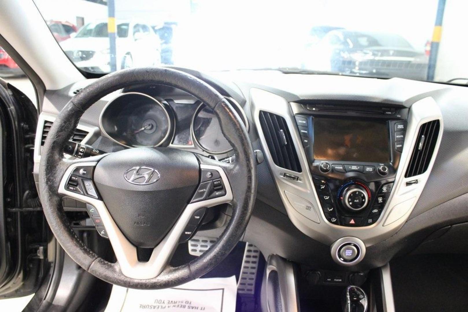 2012 Ultra Black /Gray Hyundai Veloster Base (KMHTC6ADXCU) with an 1.6L 4-Cylinder DGI DOHC engine, Automatic transmission, located at 15300 Midway Rd., Addison, TX, 75001, (972) 702-0011, 32.958321, -96.838074 - Introducing the 2012 Hyundai Veloster, now available at Midway Auto Group in Addison, Texas. This innovative hatchback combines sporty design, advanced technology, and impressive fuel efficiency, making it an excellent choice for drivers seeking both style and practicality.<br><br>Key Features:<br>< - Photo#17