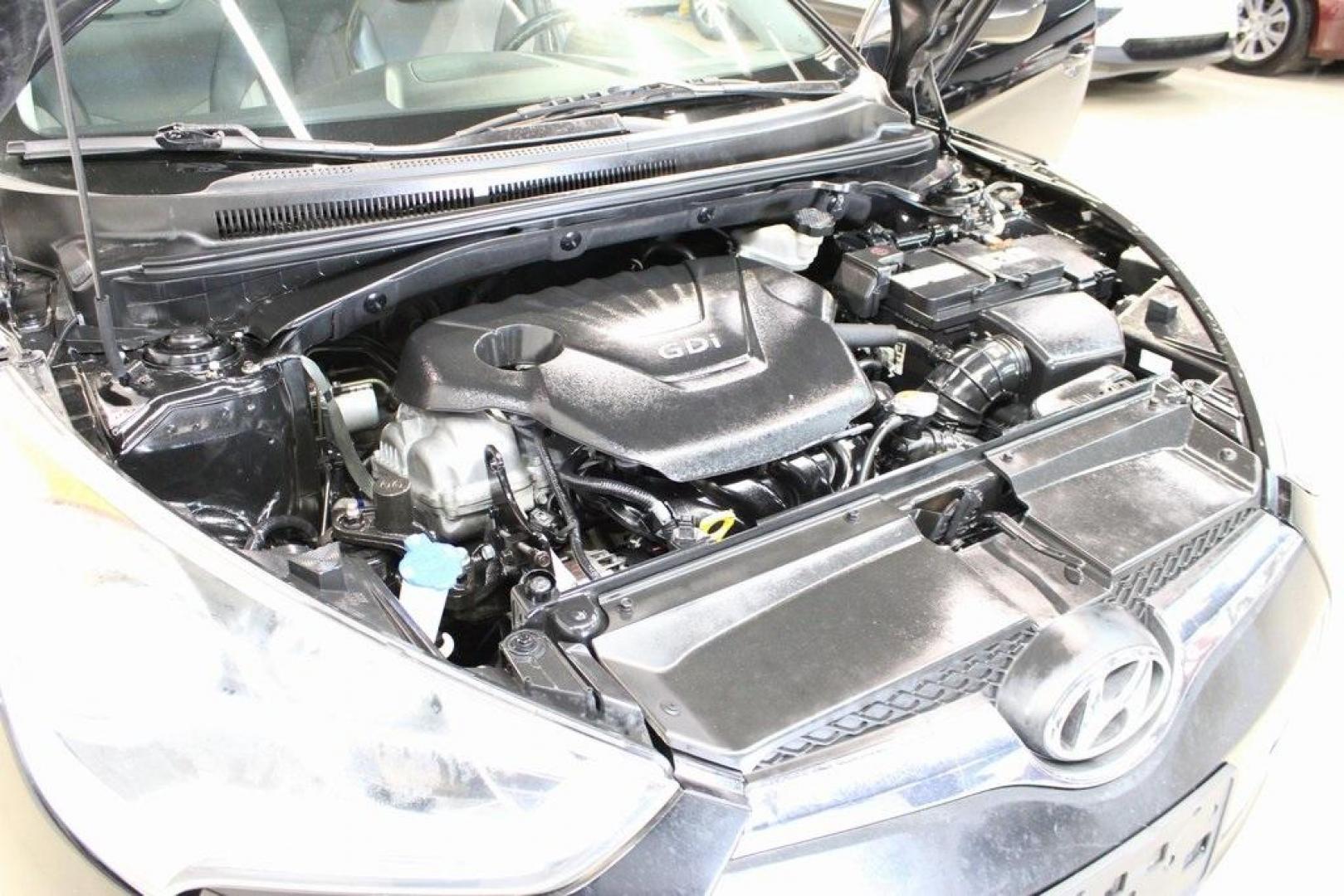 2012 Ultra Black /Gray Hyundai Veloster Base (KMHTC6ADXCU) with an 1.6L 4-Cylinder DGI DOHC engine, Automatic transmission, located at 15300 Midway Rd., Addison, TX, 75001, (972) 702-0011, 32.958321, -96.838074 - Introducing the 2012 Hyundai Veloster, now available at Midway Auto Group in Addison, Texas. This innovative hatchback combines sporty design, advanced technology, and impressive fuel efficiency, making it an excellent choice for drivers seeking both style and practicality.<br><br>Key Features:<br>< - Photo#27