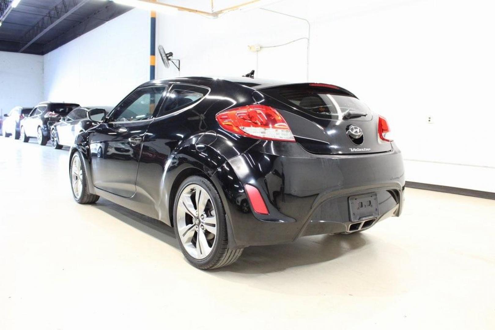 2012 Ultra Black /Gray Hyundai Veloster Base (KMHTC6ADXCU) with an 1.6L 4-Cylinder DGI DOHC engine, Automatic transmission, located at 15300 Midway Rd., Addison, TX, 75001, (972) 702-0011, 32.958321, -96.838074 - Introducing the 2012 Hyundai Veloster, now available at Midway Auto Group in Addison, Texas. This innovative hatchback combines sporty design, advanced technology, and impressive fuel efficiency, making it an excellent choice for drivers seeking both style and practicality.<br><br>Key Features:<br>< - Photo#3