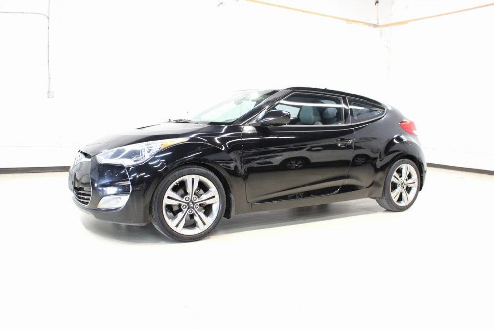 2012 Ultra Black /Gray Hyundai Veloster Base (KMHTC6ADXCU) with an 1.6L 4-Cylinder DGI DOHC engine, Automatic transmission, located at 15300 Midway Rd., Addison, TX, 75001, (972) 702-0011, 32.958321, -96.838074 - Introducing the 2012 Hyundai Veloster, now available at Midway Auto Group in Addison, Texas. This innovative hatchback combines sporty design, advanced technology, and impressive fuel efficiency, making it an excellent choice for drivers seeking both style and practicality.<br><br>Key Features:<br>< - Photo#4