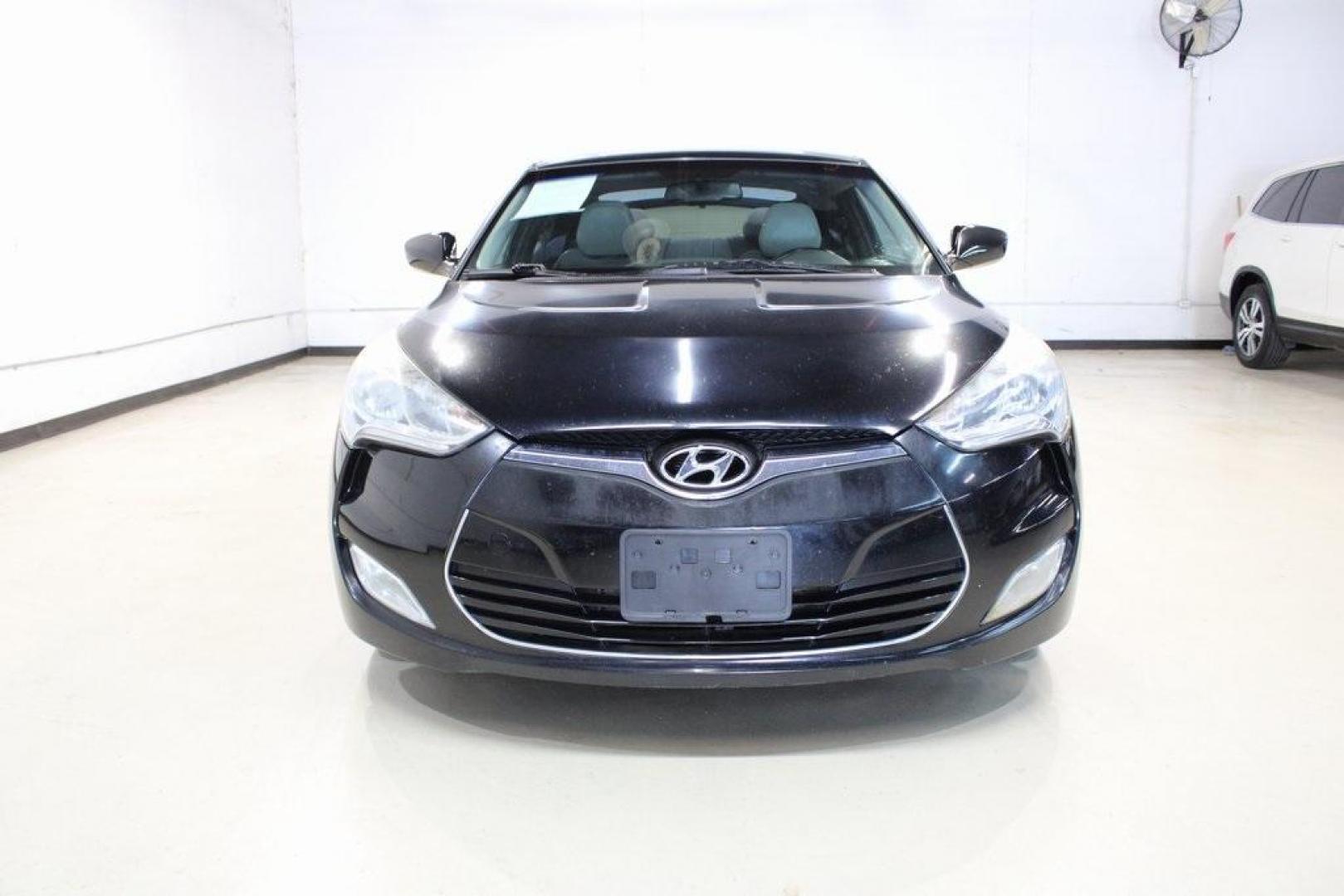 2012 Ultra Black /Gray Hyundai Veloster Base (KMHTC6ADXCU) with an 1.6L 4-Cylinder DGI DOHC engine, Automatic transmission, located at 15300 Midway Rd., Addison, TX, 75001, (972) 702-0011, 32.958321, -96.838074 - Introducing the 2012 Hyundai Veloster, now available at Midway Auto Group in Addison, Texas. This innovative hatchback combines sporty design, advanced technology, and impressive fuel efficiency, making it an excellent choice for drivers seeking both style and practicality.<br><br>Key Features:<br>< - Photo#5