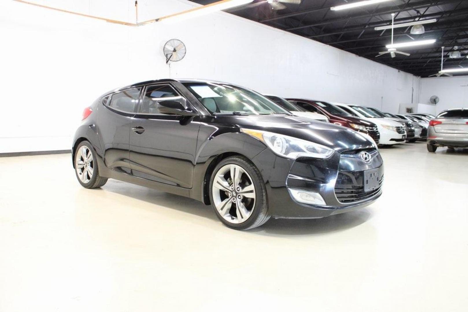 2012 Ultra Black /Gray Hyundai Veloster Base (KMHTC6ADXCU) with an 1.6L 4-Cylinder DGI DOHC engine, Automatic transmission, located at 15300 Midway Rd., Addison, TX, 75001, (972) 702-0011, 32.958321, -96.838074 - Introducing the 2012 Hyundai Veloster, now available at Midway Auto Group in Addison, Texas. This innovative hatchback combines sporty design, advanced technology, and impressive fuel efficiency, making it an excellent choice for drivers seeking both style and practicality.<br><br>Key Features:<br>< - Photo#6