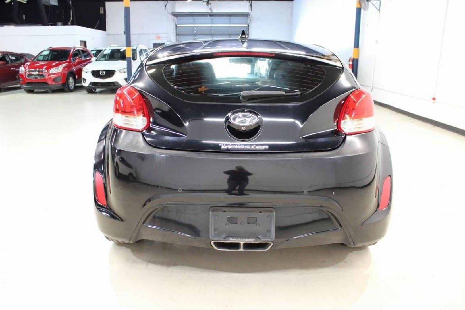 2012 Ultra Black /Gray Hyundai Veloster Base (KMHTC6ADXCU) with an 1.6L 4-Cylinder DGI DOHC engine, Automatic transmission, located at 15300 Midway Rd., Addison, TX, 75001, (972) 702-0011, 32.958321, -96.838074 - Introducing the 2012 Hyundai Veloster, now available at Midway Auto Group in Addison, Texas. This innovative hatchback combines sporty design, advanced technology, and impressive fuel efficiency, making it an excellent choice for drivers seeking both style and practicality.<br><br>Key Features:<br>< - Photo#7
