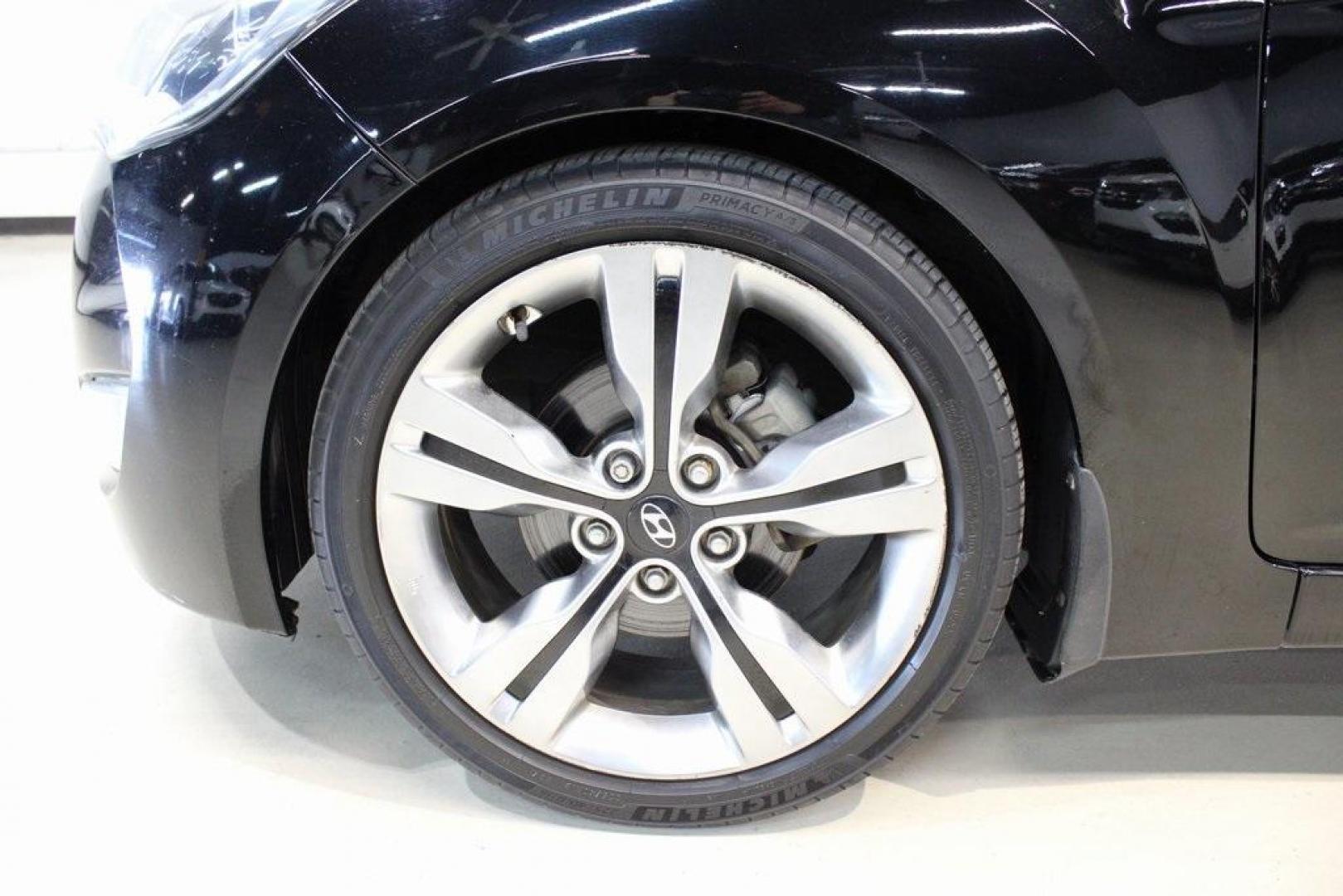 2012 Ultra Black /Gray Hyundai Veloster Base (KMHTC6ADXCU) with an 1.6L 4-Cylinder DGI DOHC engine, Automatic transmission, located at 15300 Midway Rd., Addison, TX, 75001, (972) 702-0011, 32.958321, -96.838074 - Introducing the 2012 Hyundai Veloster, now available at Midway Auto Group in Addison, Texas. This innovative hatchback combines sporty design, advanced technology, and impressive fuel efficiency, making it an excellent choice for drivers seeking both style and practicality.<br><br>Key Features:<br>< - Photo#8
