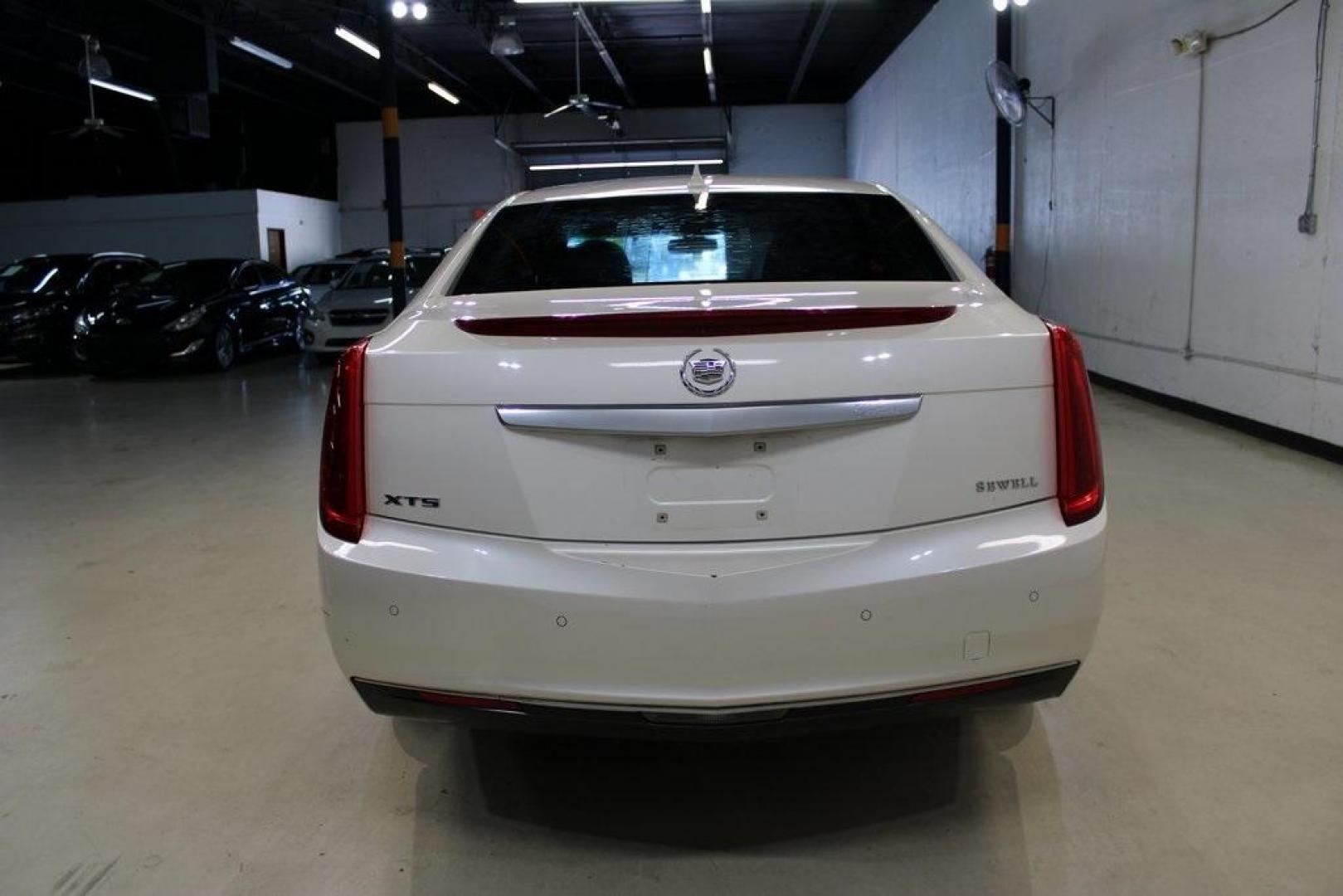 2013 White Diamond Tricoat /Shale/Cocoa Cadillac XTS Base (2G61N5S32D9) with an 3.6L V6 DGI DOHC VVT engine, Automatic transmission, located at 15300 Midway Rd., Addison, TX, 75001, (972) 702-0011, 32.958321, -96.838074 - Introducing the 2013 Cadillac XTS Luxury Collection, now available at Midway Auto Group in Addison, Texas. This full-size luxury sedan seamlessly combines sophisticated design, advanced technology, and a powerful performance, offering an exceptional driving experience for those who demand elegance a - Photo#7